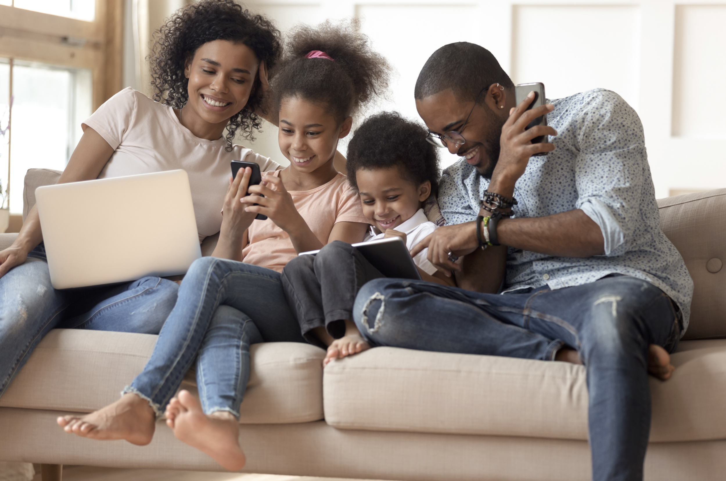 Diverse family on couch Hermosa Beach
