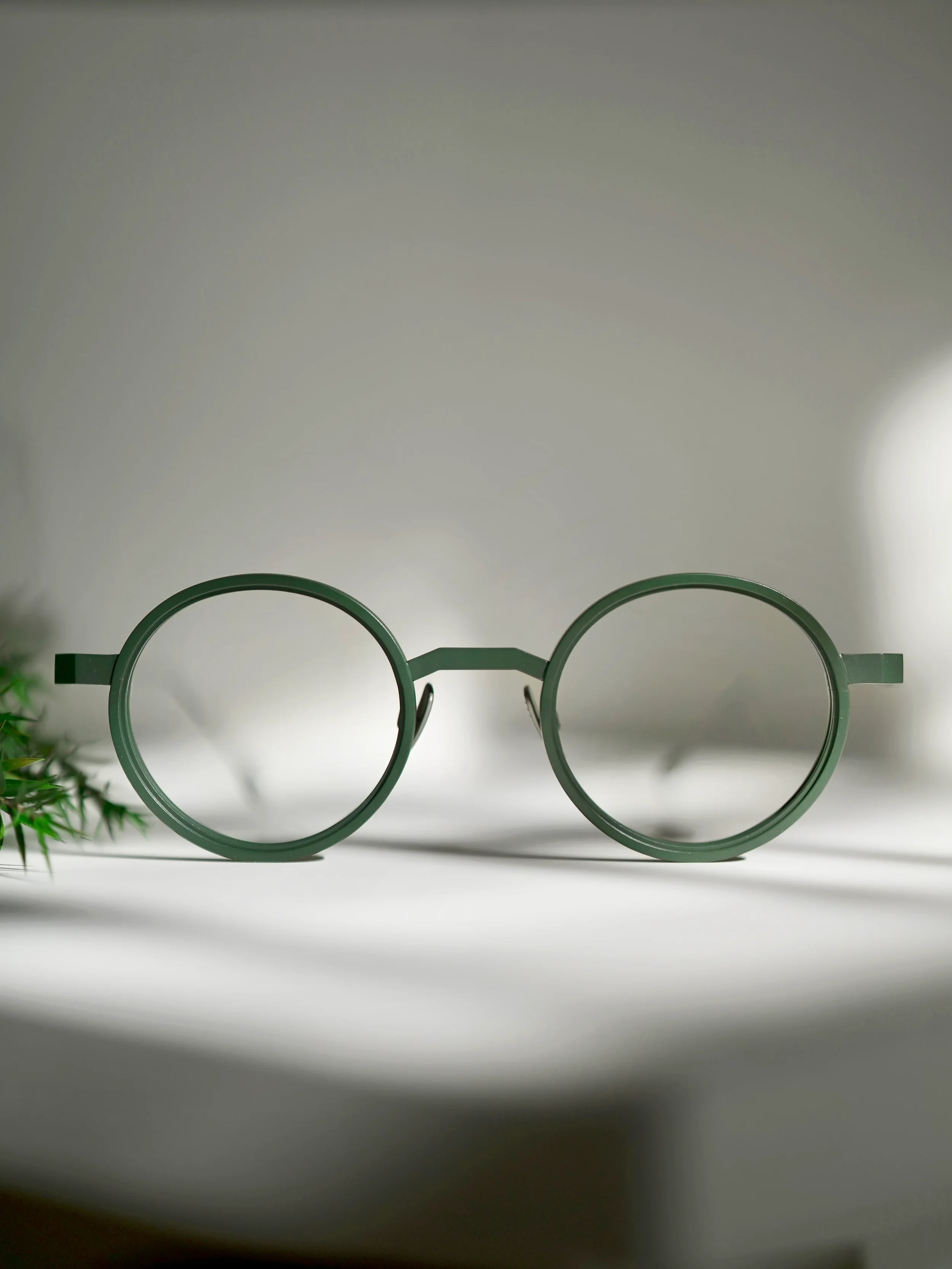 Green titanium eyeglasses by Clément Lunetier