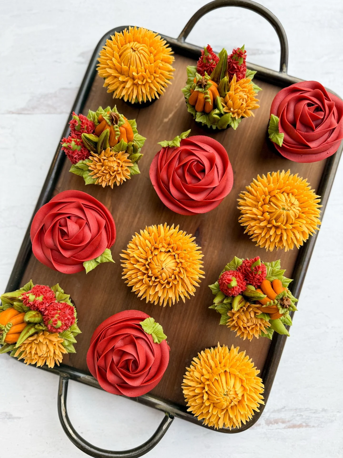 Fall blooms are officially in full swing over here!

This cozy set gives me all the autumn feelings &mdash; deep cranberry roses, golden mums, and the cutest little pumpkin + floral clusters. Every cupcake is its own tiny piece of edible art, and tog