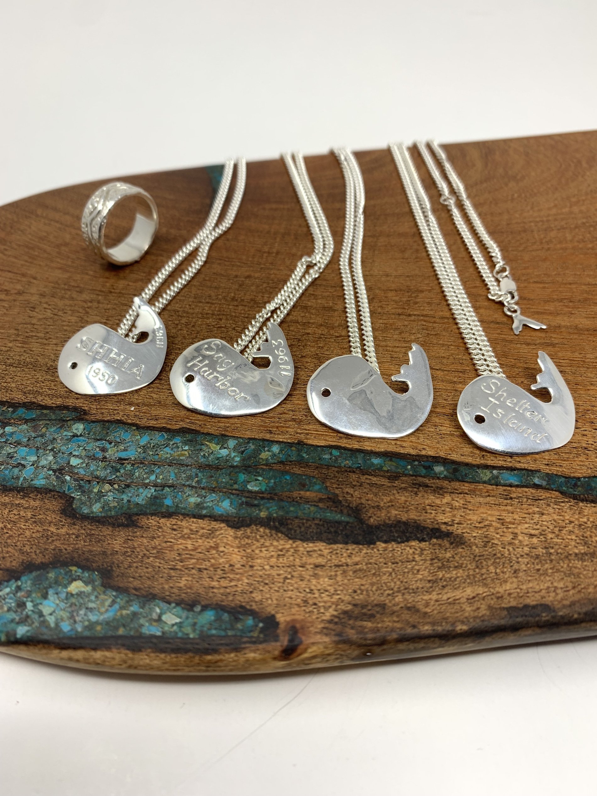 four-sterling-silver-whales-ring-display.jpeg
