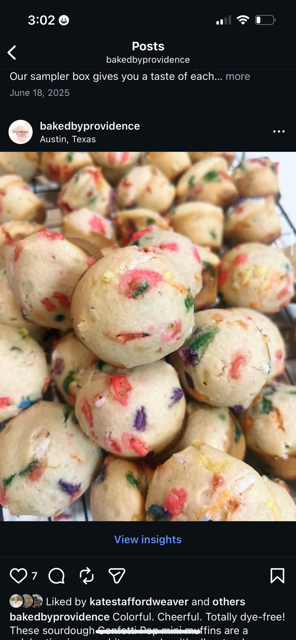 A tray of colorful birthday cake balls with sprinkles of red, green, purple, and yellow.
