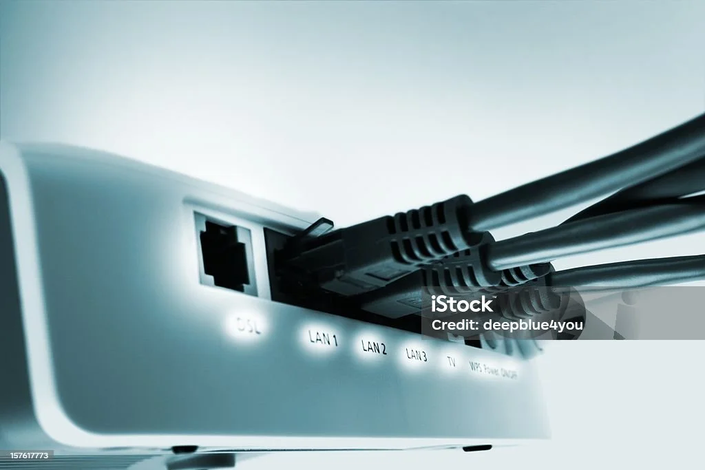 Close-up of a router with connected Ethernet cables.