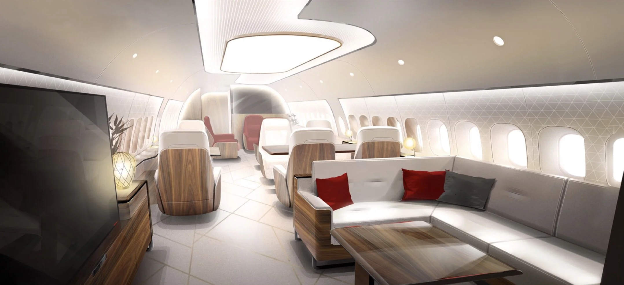 Luxurious airplane cabin interior with white seating, wooden accents, red and gray pillows, and soft lighting, designed by Sarah Larranaga.