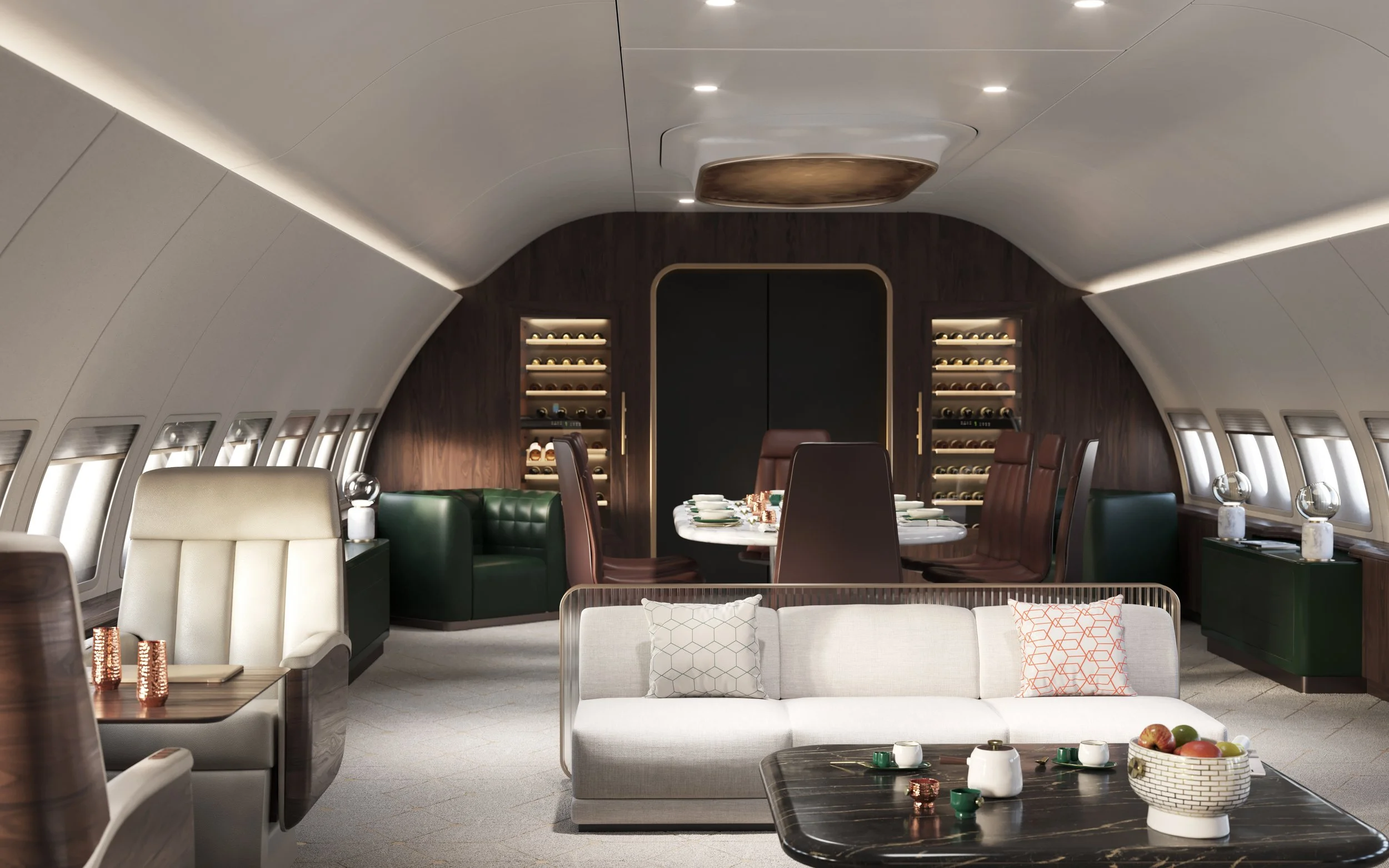 Luxury airplane interior designed by Sarah Larranaga with a white sofa, dining table, and plush armchairs featuring pillows, set in a modern, well-lit cabin.