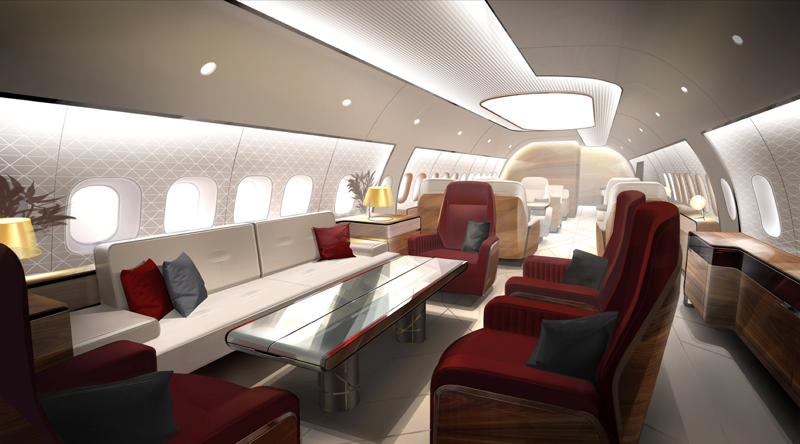Interior of a modern airplane cabin designed by Sarah Larranaga with luxury seating, including red and beige armchairs, a glass-topped table, and decorative pillows, illuminated by soft lighting.