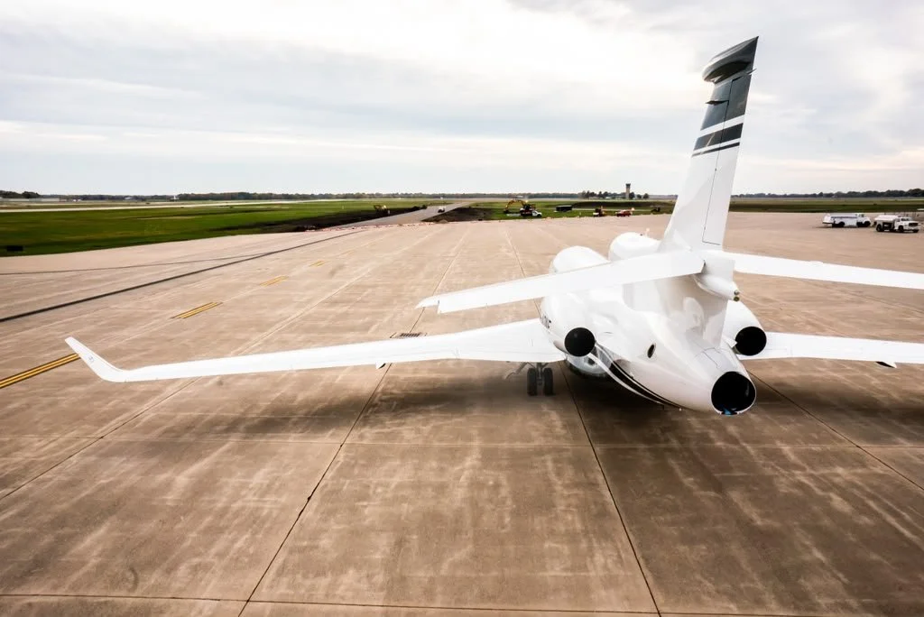 An image of a bespoke Gulfstream private jet designed by Sarah Larranaga on the tarmac.