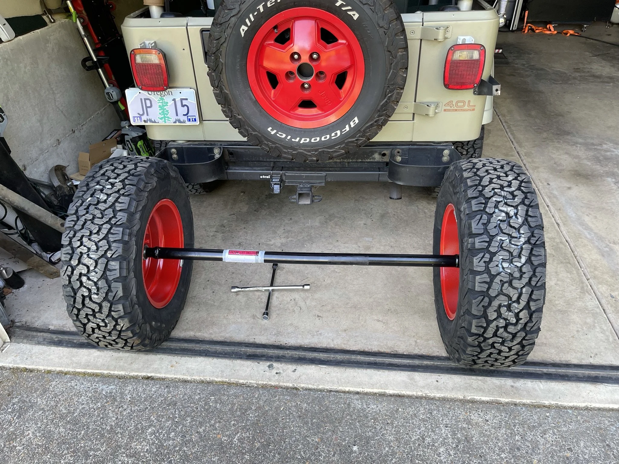 I found a trailer axle with the correct bolt pattern and wheel offset to fit neatly into the original trailer fenders while using the Jeep wheels. If I have a flat while trailering, I can use my Jeep's spare!