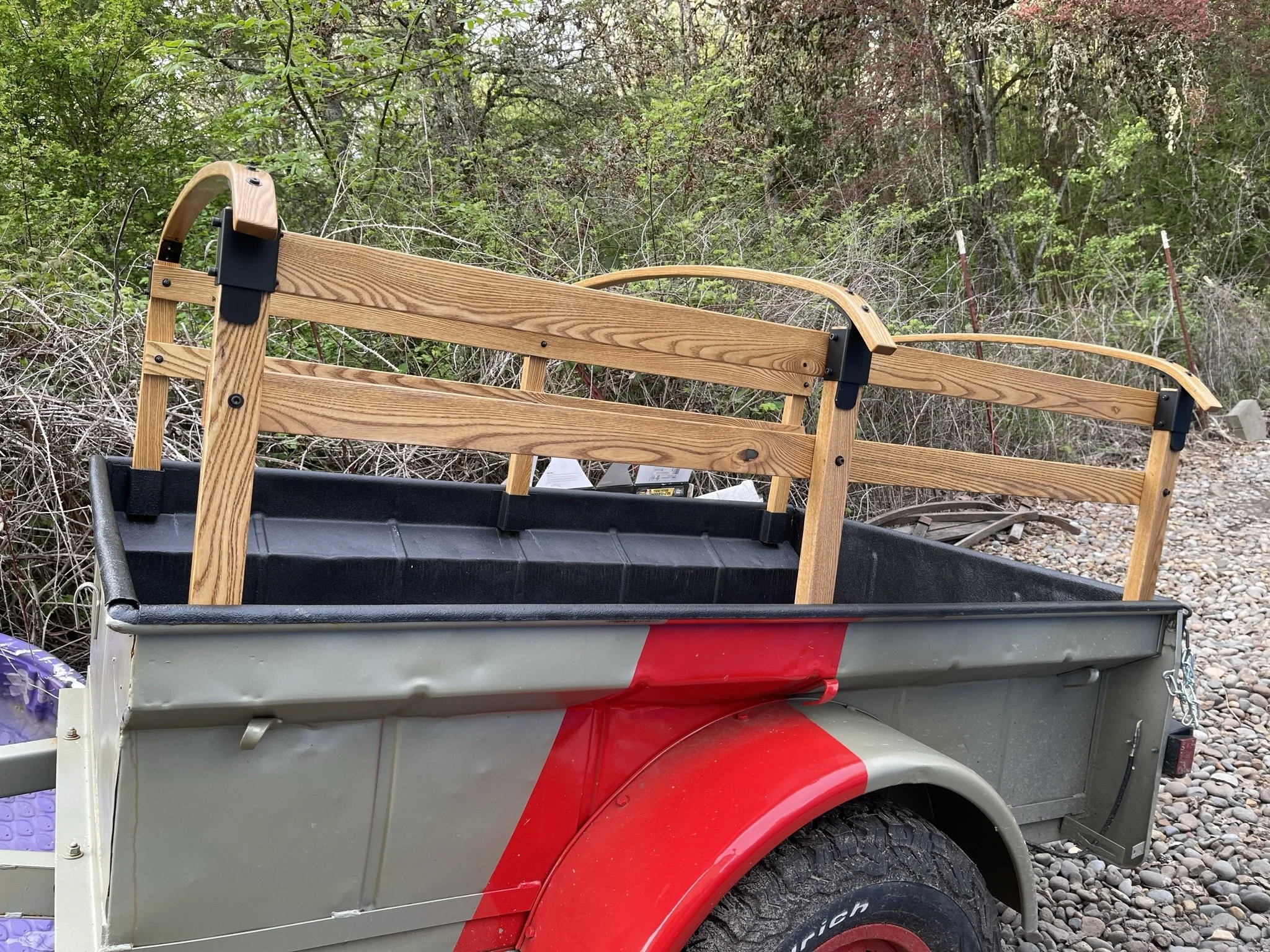 My dad made new hardwood replacement rails using the originals as templates. The curves were created by laminating strips together into the shape. A tough lacquer was applied for resiliency.