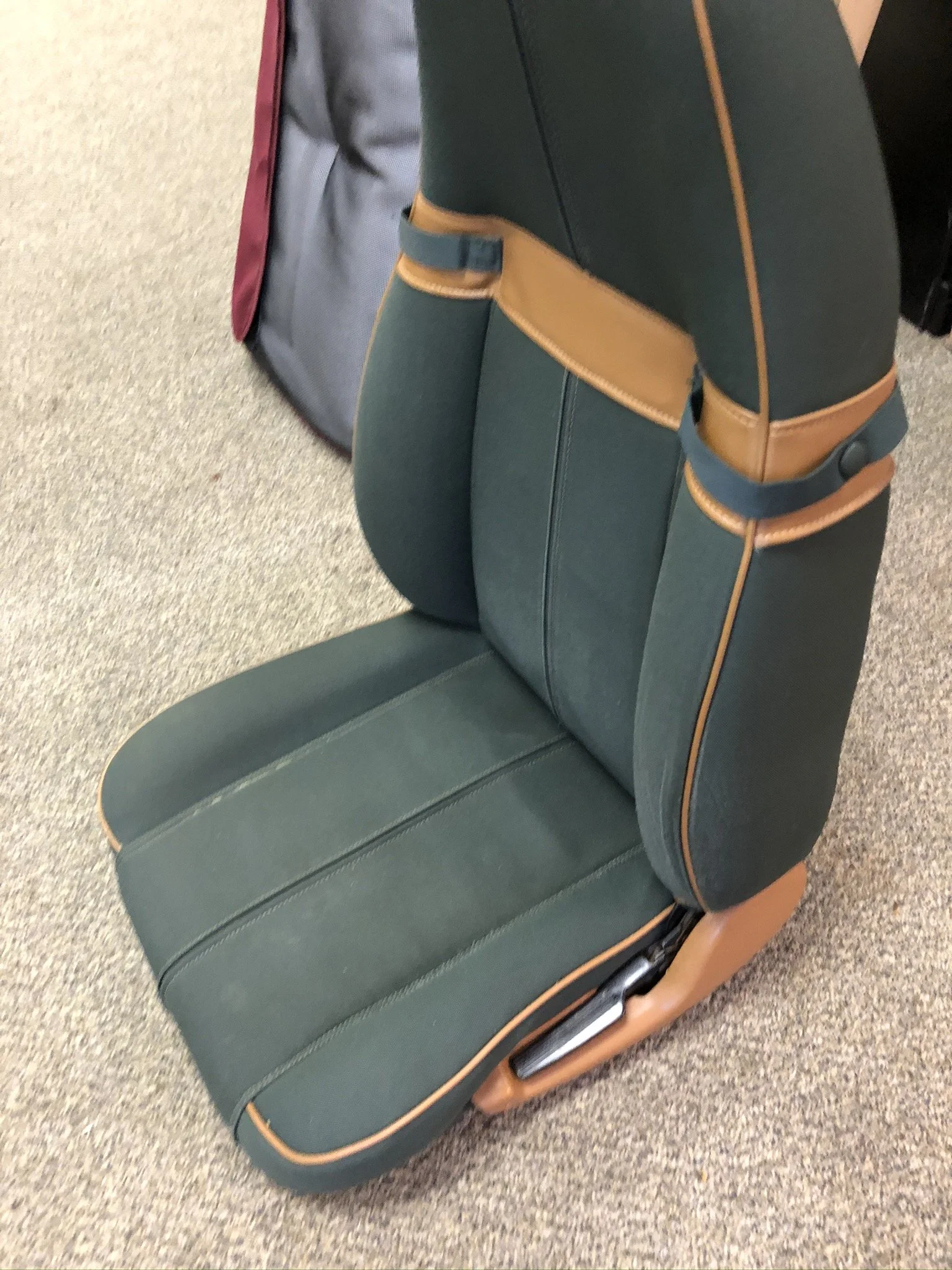 Beaverton Auto Upholstery found NOS green canvas material and made a perfect repair. 