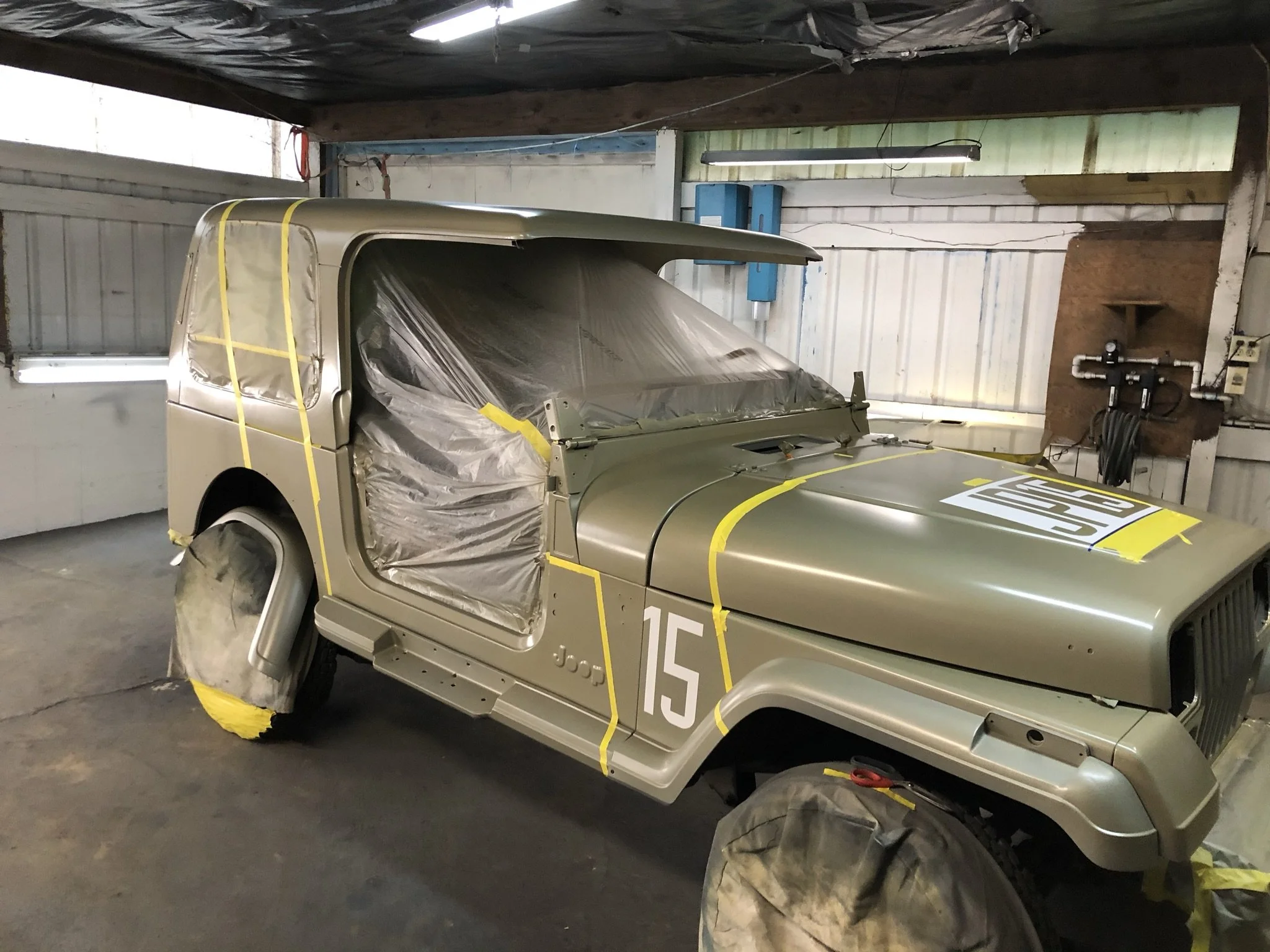 I spent a full day with Jake pouring over the painting guide in the Jurassic Park Motorpool Reference section and we masked the car for the red parts. 