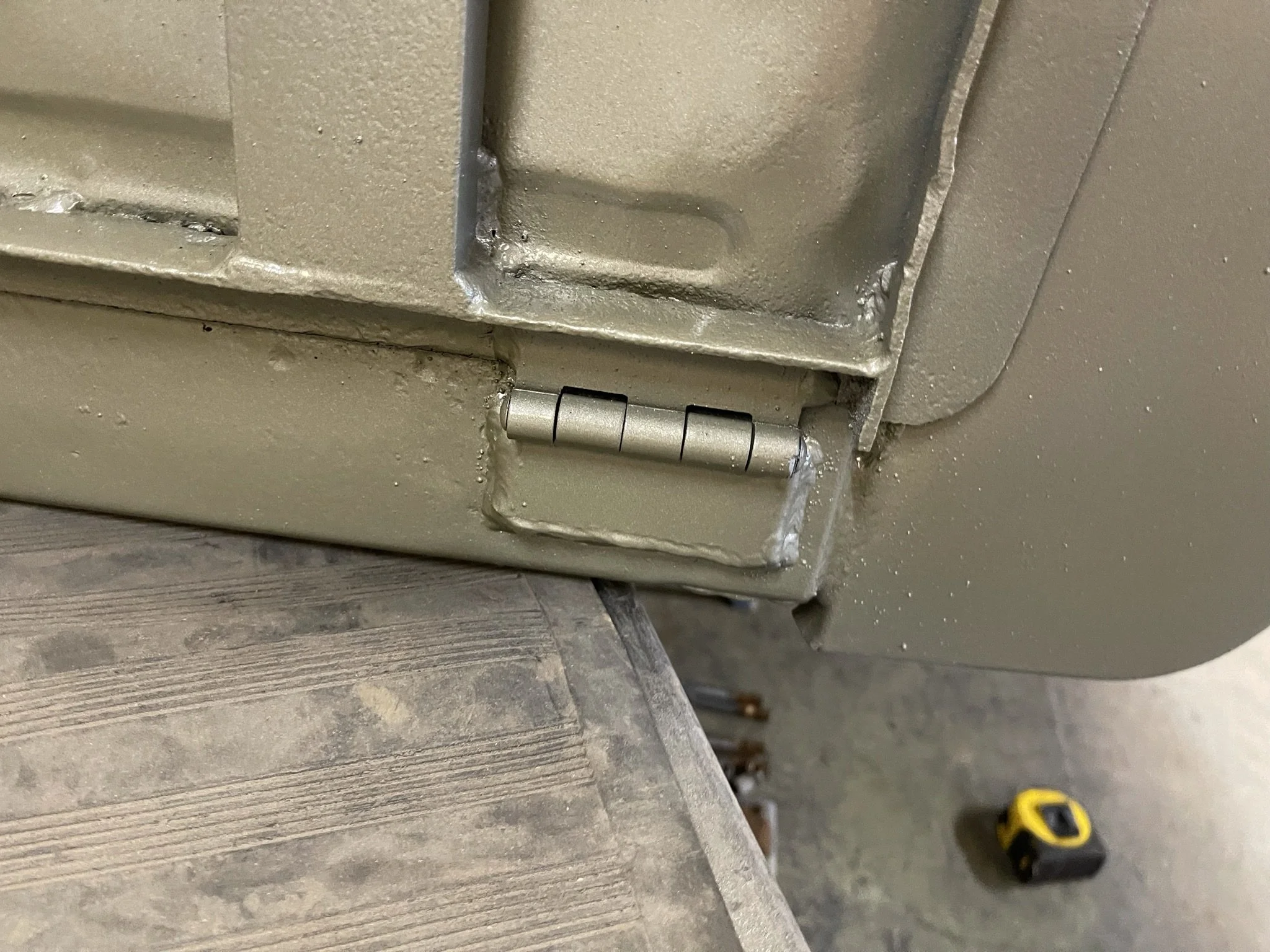 New hinges for the fold-down tailgate were added. My grandpa worked on similar trailers in the Korean War, and he said these hinges were always getting broken off by careless GIs. 