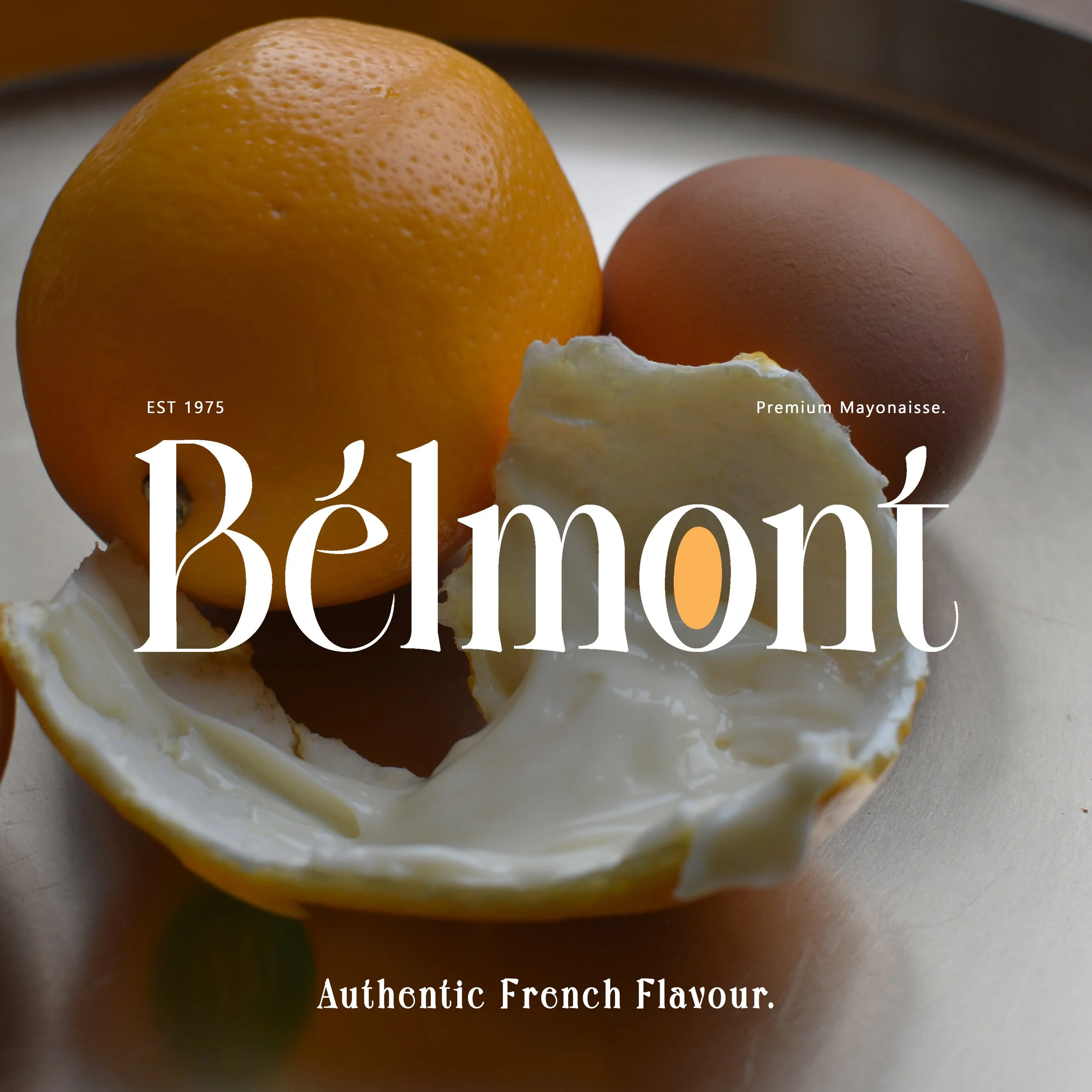 Close-up of a lemon, an egg, and a piece of mayonnaise with overlaying text 'Béémont', 'EST 1975', 'Premium Mayonnaise', and 'Authentic French Flavour'.