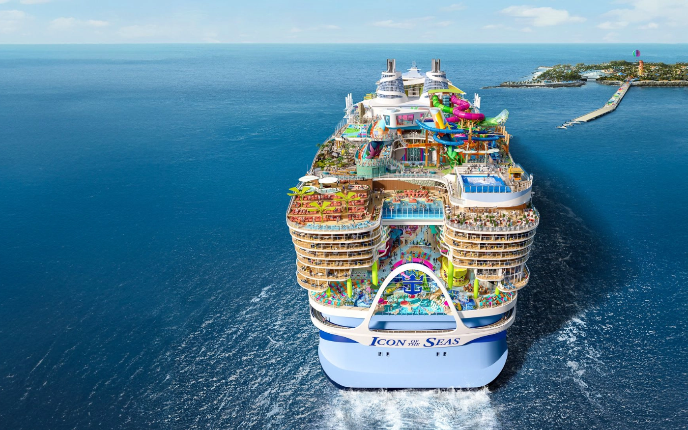 A large cruise ship named 'Icon of the Seas' sailing in the ocean, with multiple decks featuring water slides, pools, lounge areas, and recreational facilities.