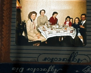 'My sister and I with my mother, Aunt, Uncle and Granny in the dining room at Number 5' Courtesy of Fiona Hunter 