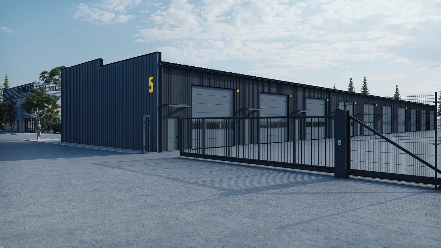Exterior of a Ten Mile building showing a row of overhead doors behind the security gate