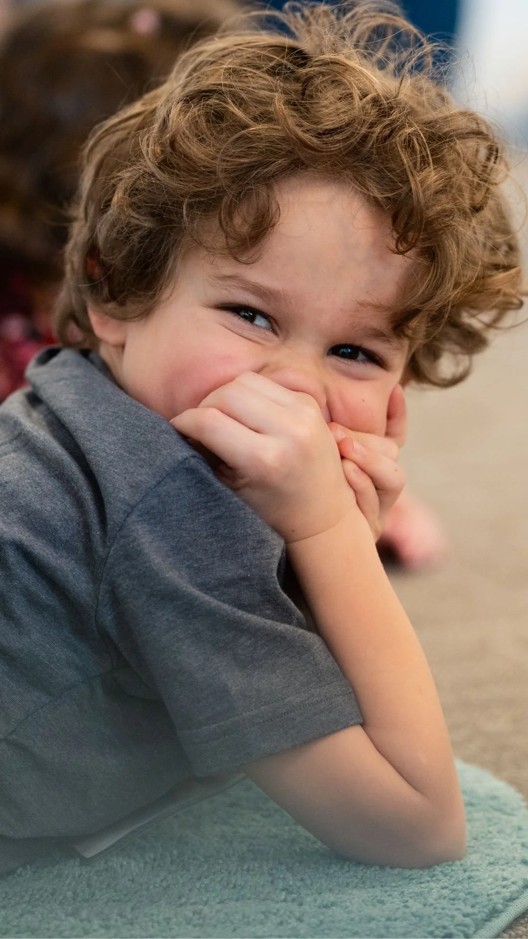 child resting on elbows vertical.jpg