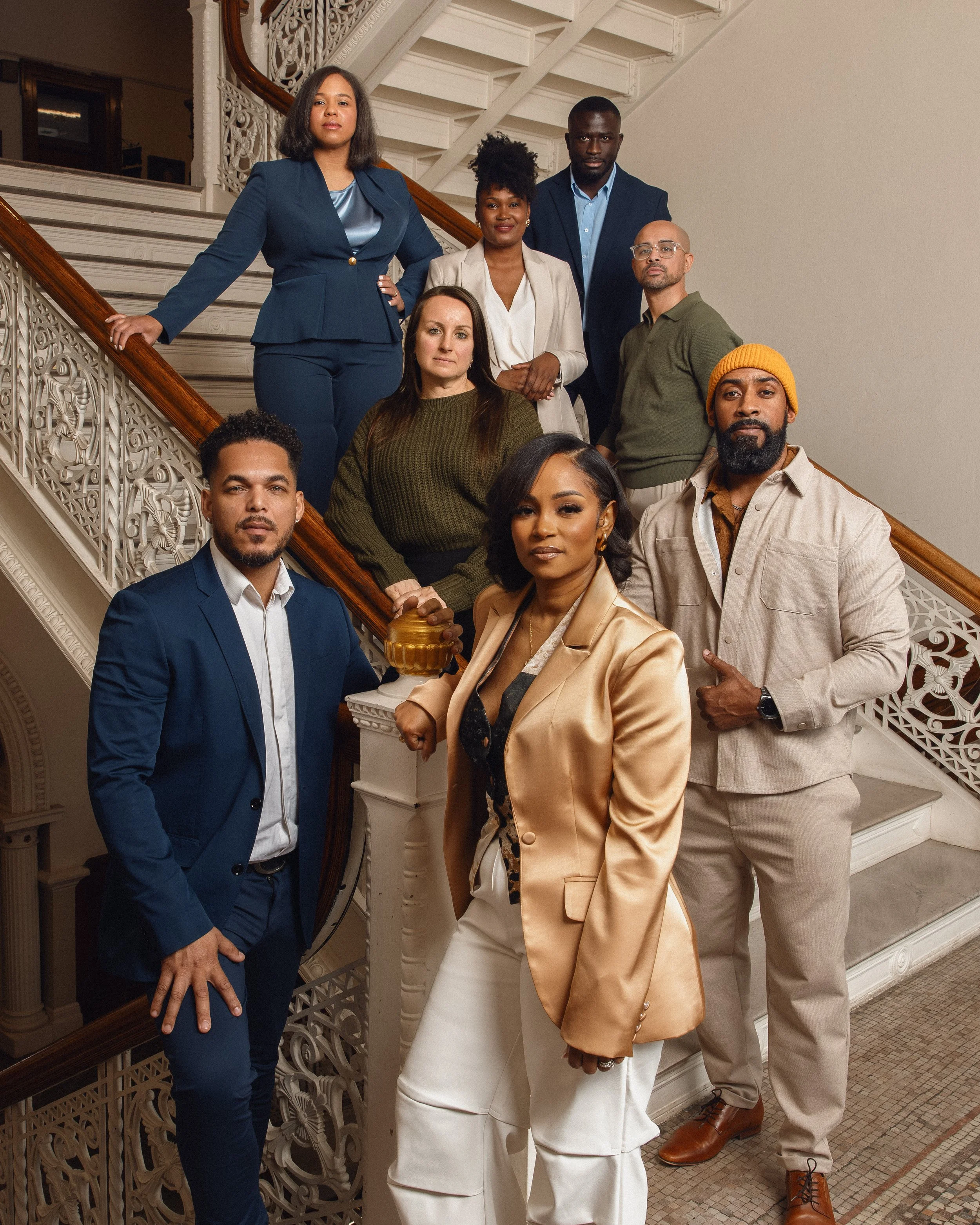 The Greater Brockton Young Professionals Freshman Class of 26' posing a inside the staircase of Brockton CIty Hall. Nelson Fernandes, Salo Afonseca, Rui Lopes, Francois & Iraimi Diatta, Katie Balboni, Dr, Ellie Paris Miranda, Veronica Thompson