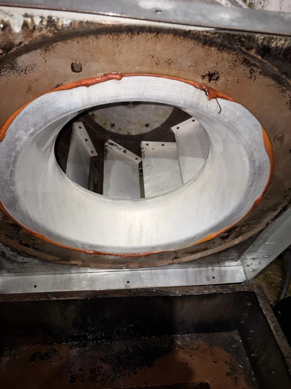 After cleaning: cleaned commercial exhaust fan housing and fan opening