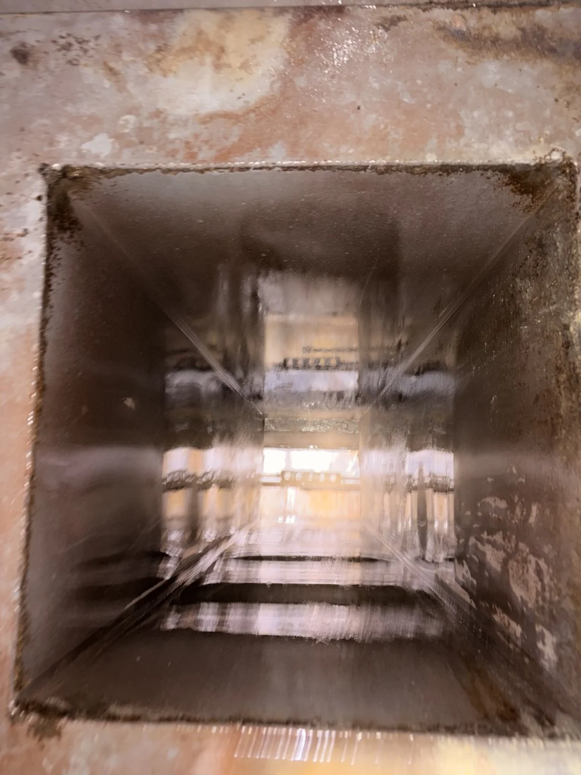 After cleaning: restored metal interior of a commercial kitchen duct and plenum