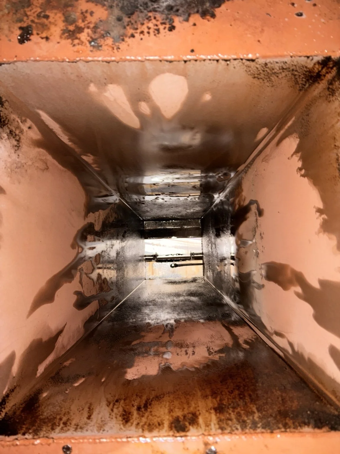 Before cleaning: grease buildup inside a commercial kitchen duct and plenum