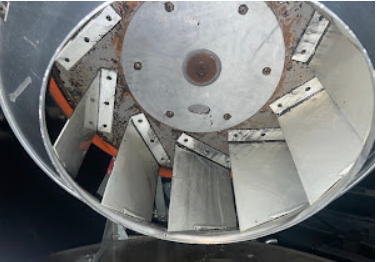After cleaning: restored metal blades inside a commercial exhaust fan