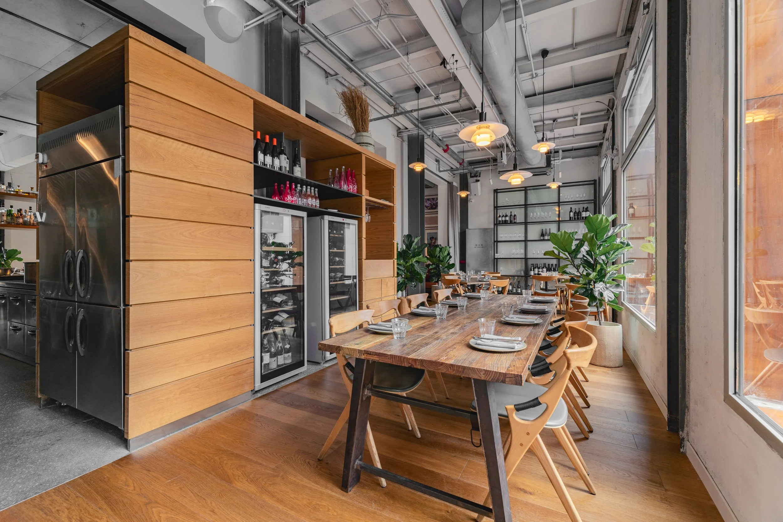 Wide-angle view of BOR Eatery's dining area showcasing open kitchen concept and seating arrangements