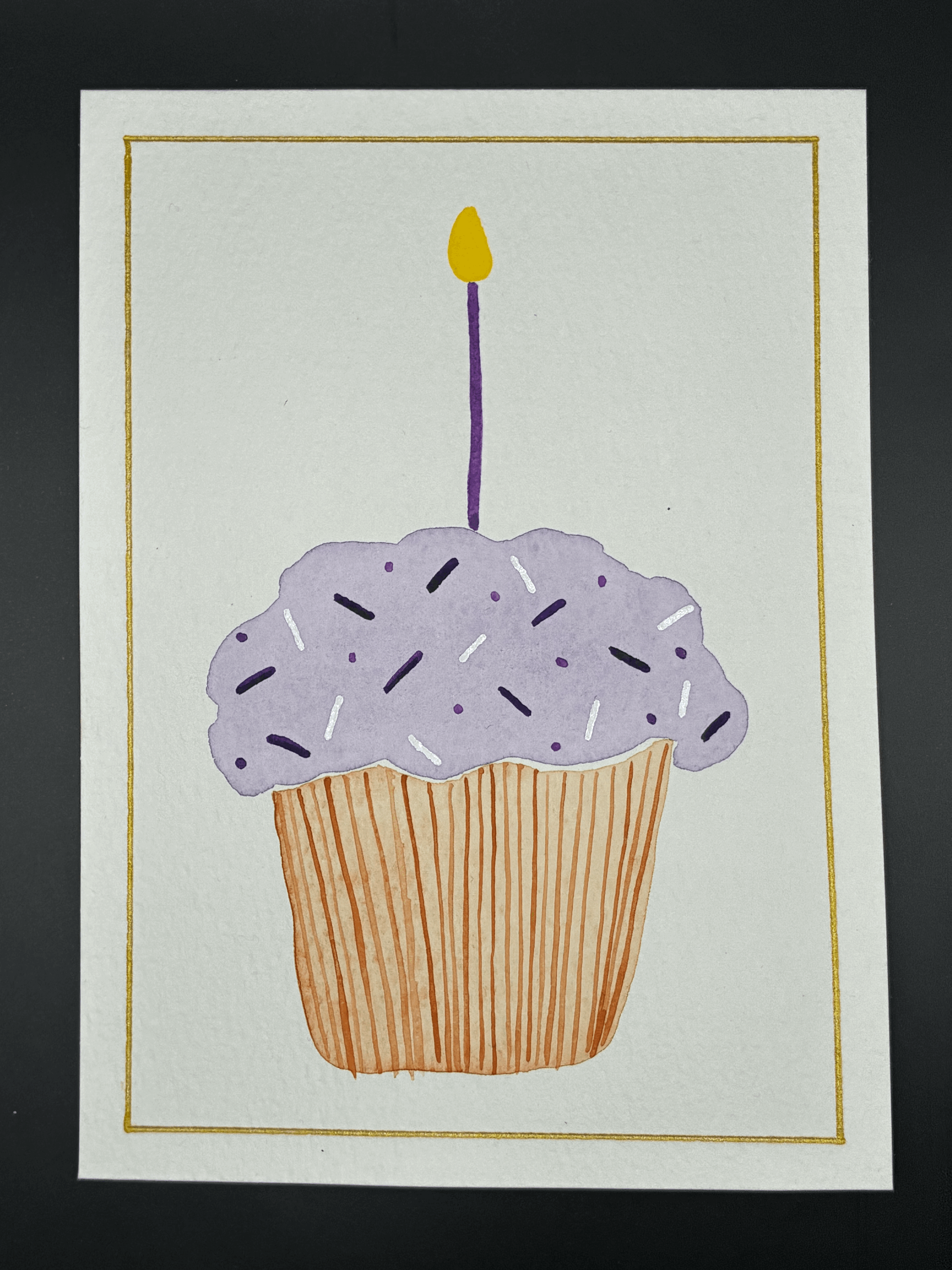 Purple and white cupcake