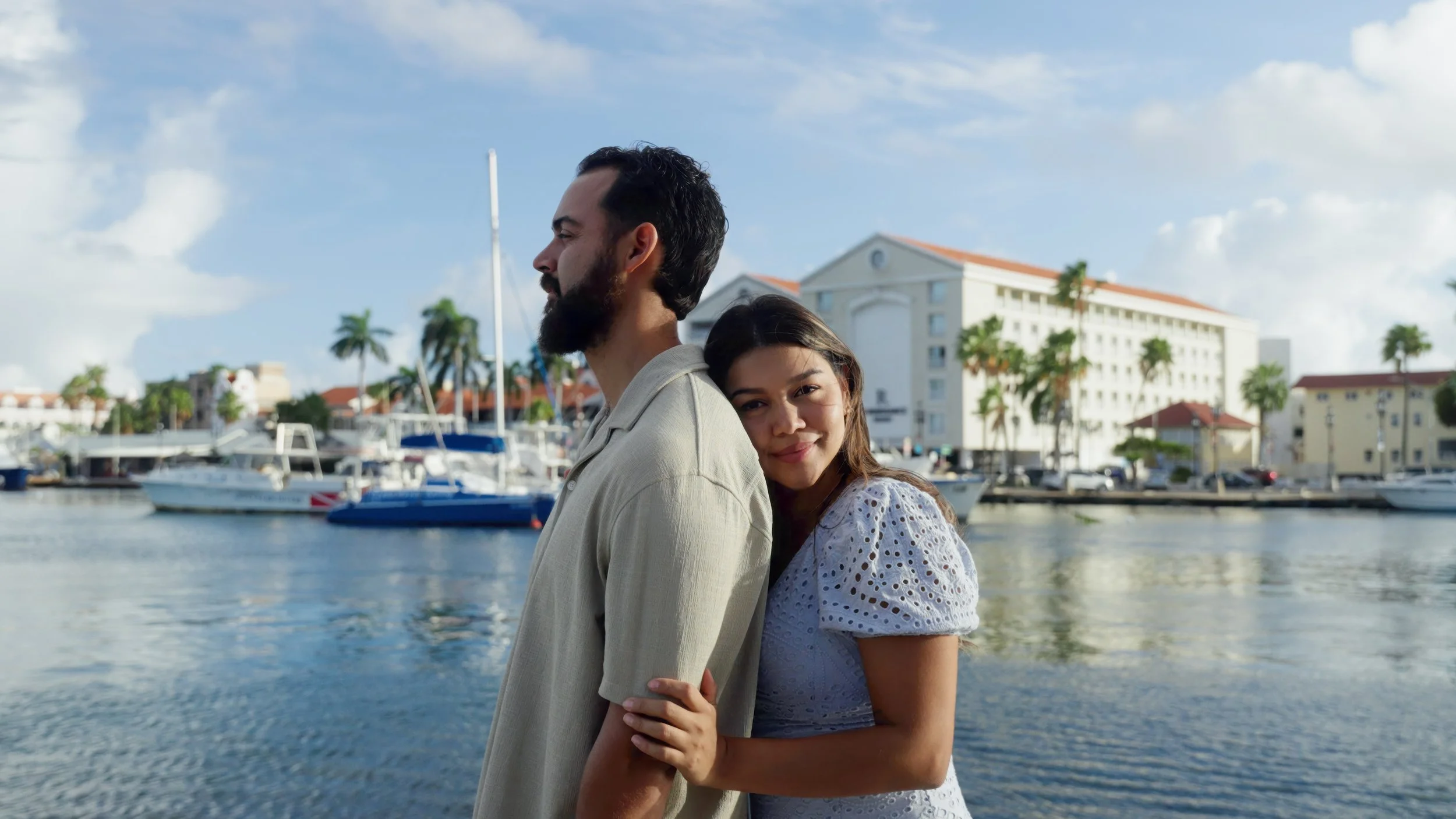 Aruba wedding couple Lina and Ronald during an adventure session at Renaissance Marina in Oranjestad, Aruba, with Aruba wedding videographer Wedding Films by Mira
