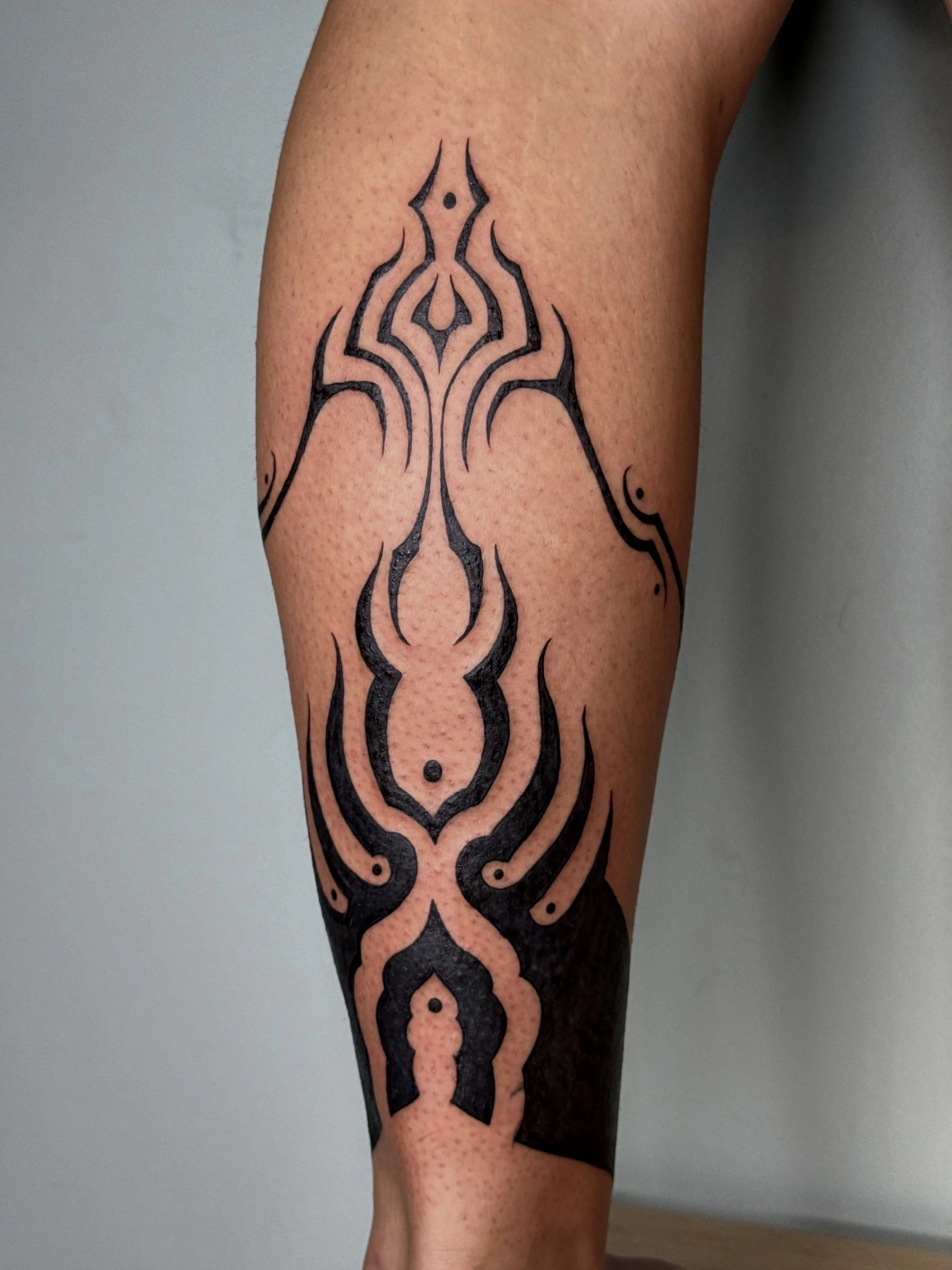 Artist:  Mond Ink— Neo-tribal, blackwork leg/ calf piece