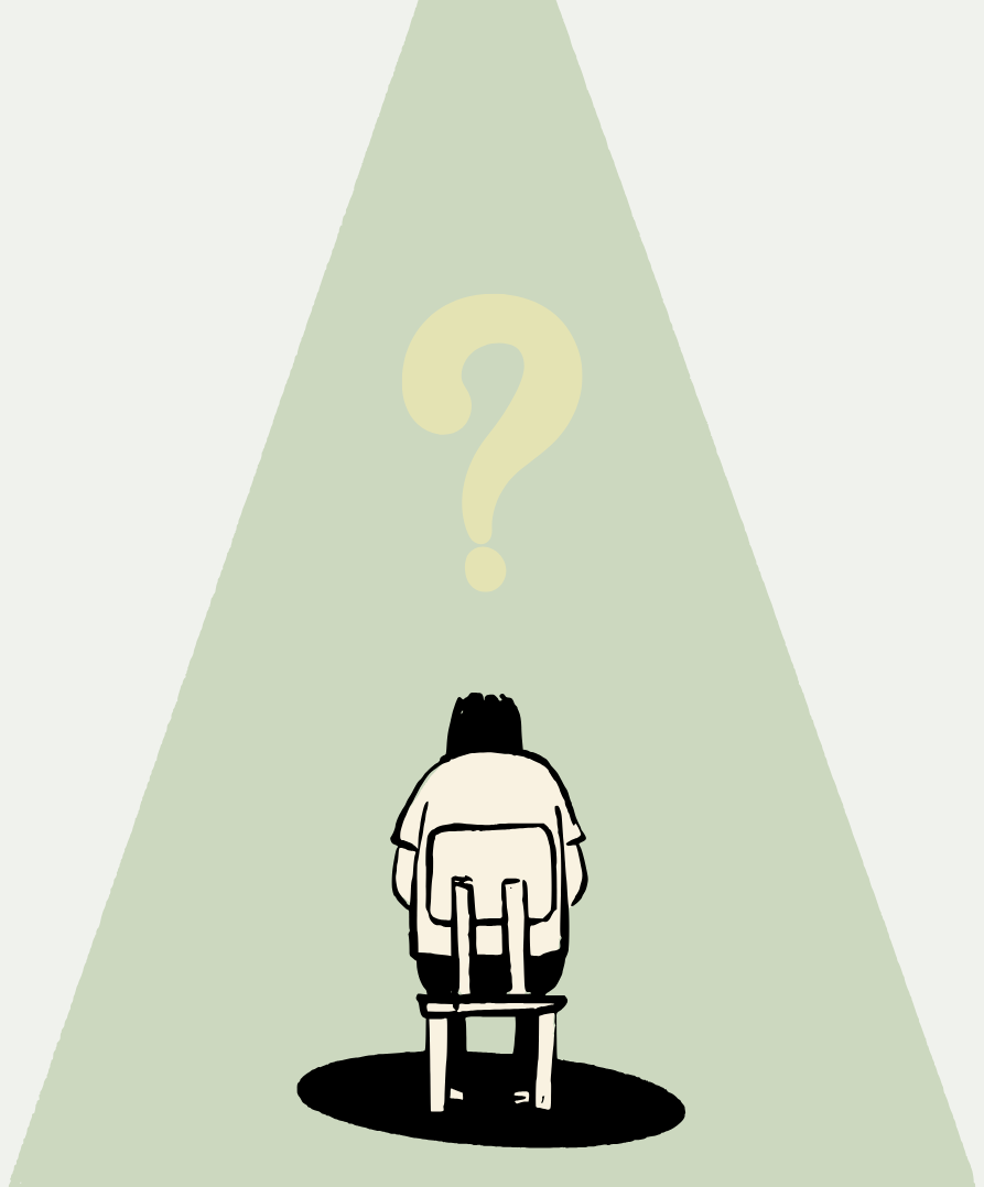 A person sitting on a chair with their back facing the viewer, under a spotlight with a large question mark above them.