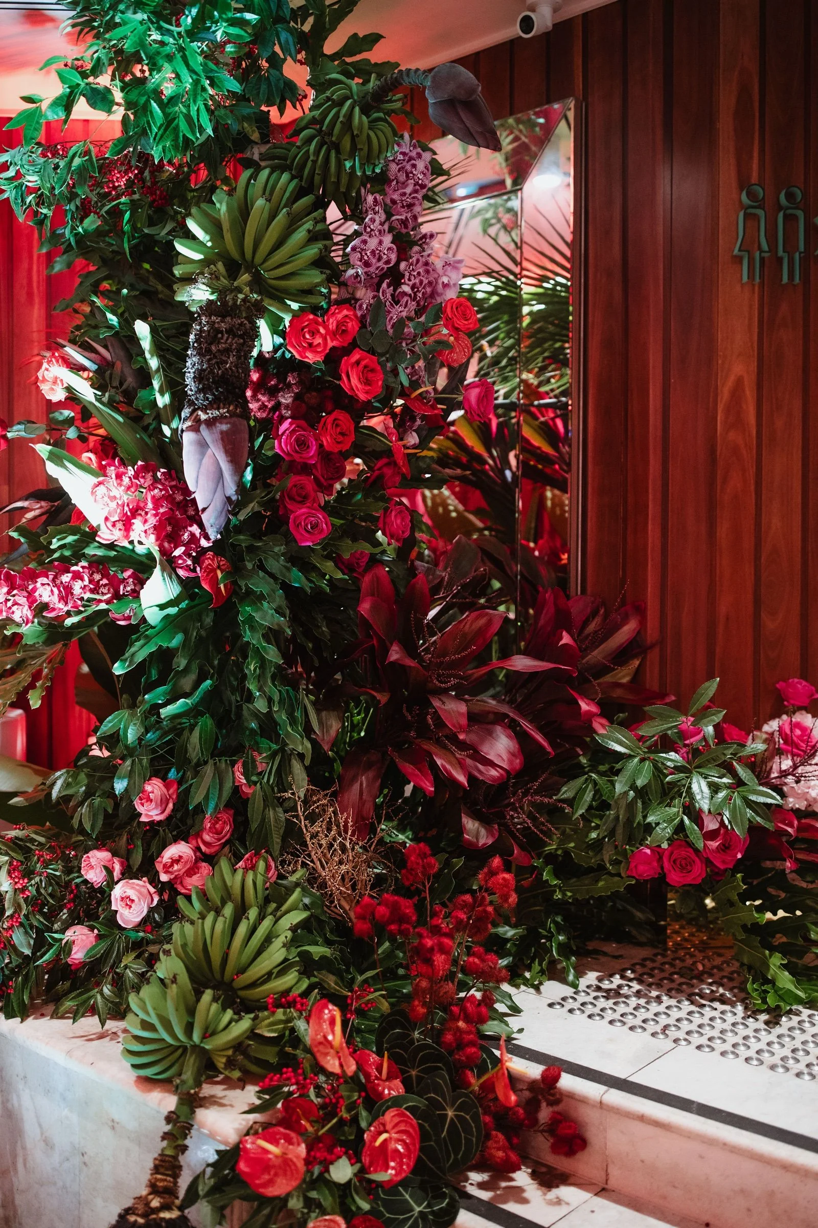 Vivid tropical floral installation for a milestone celebration