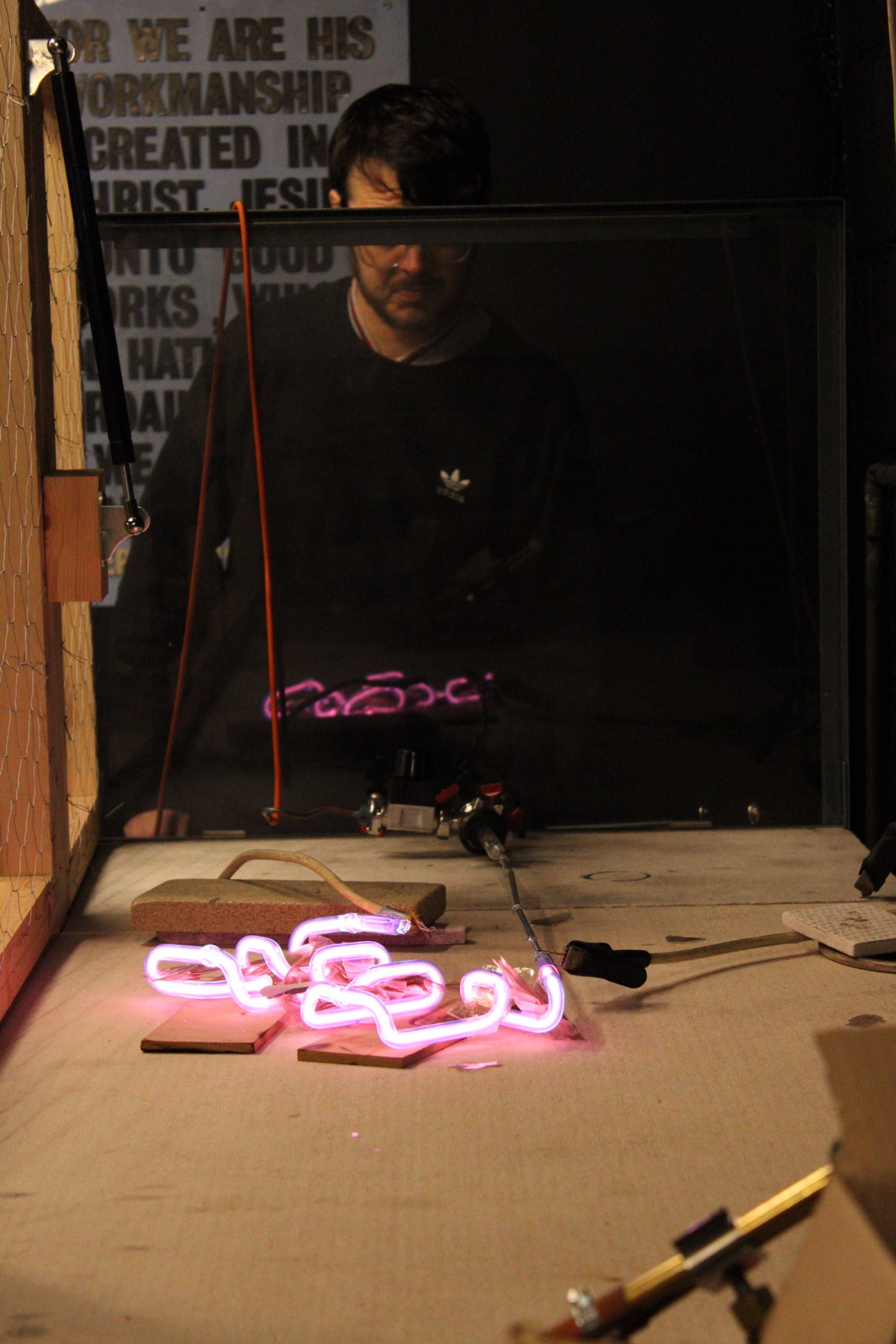 Comparison explaining the difference between LED neon flex and real hand-bent glass neon signage.