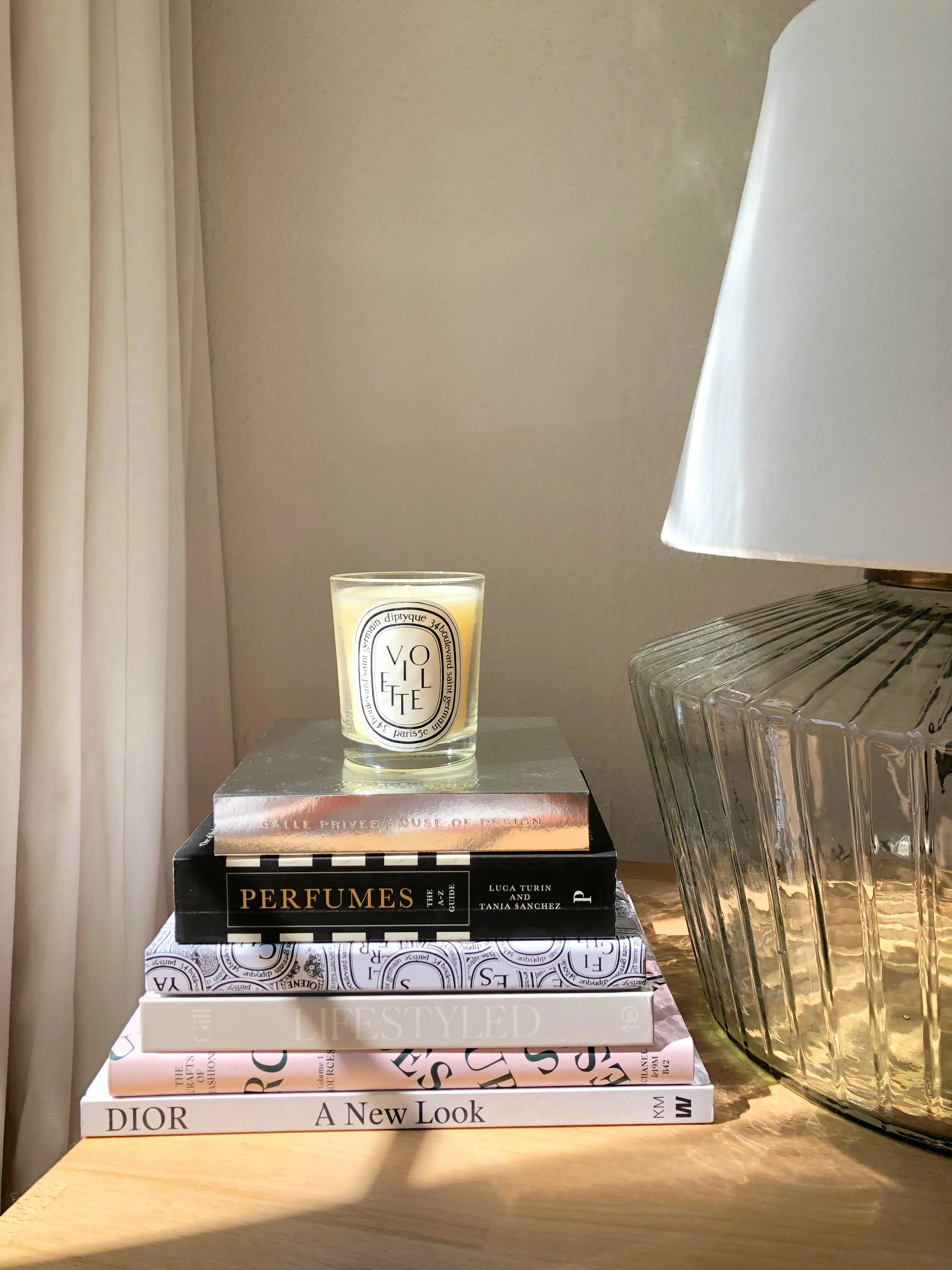 candle atop a stack of books