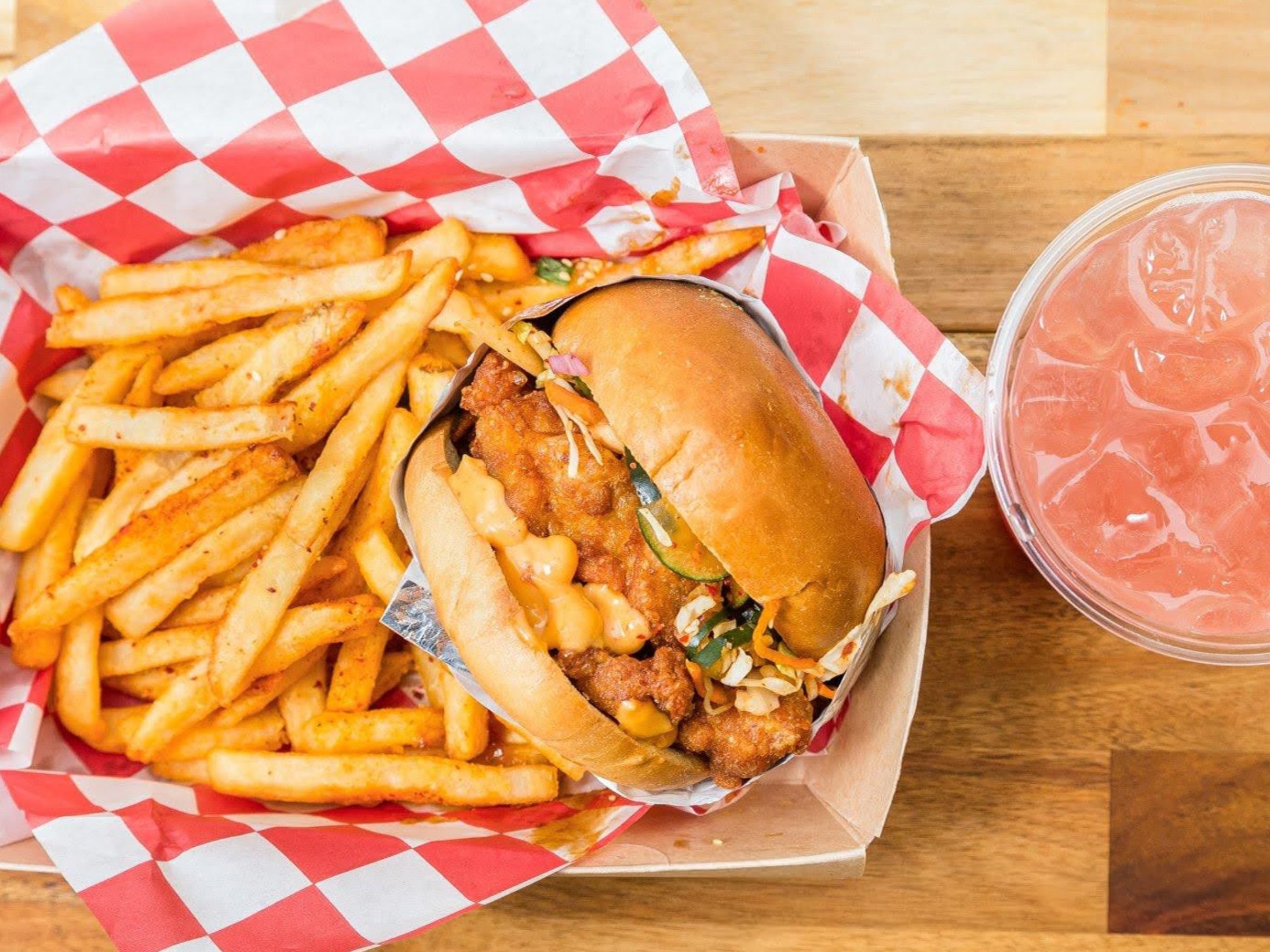 Fried chicken sandwich meal with fries and watermelon agua fresca