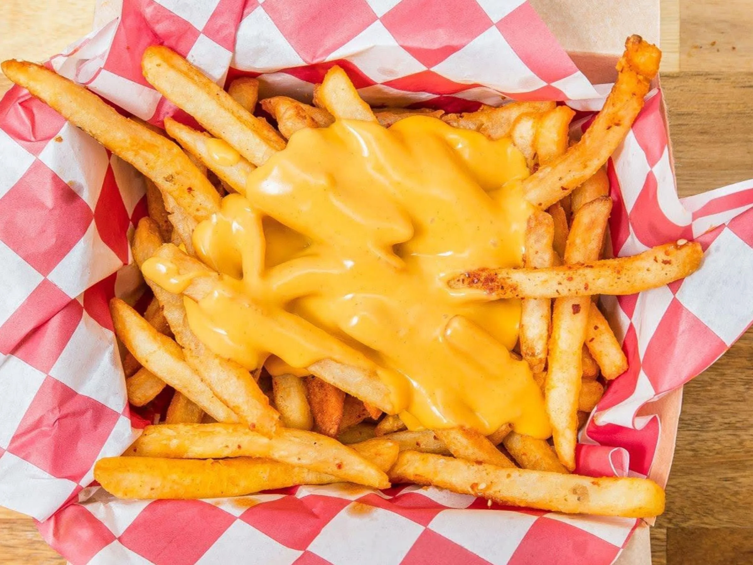 Crispy fries with house cheese sauce