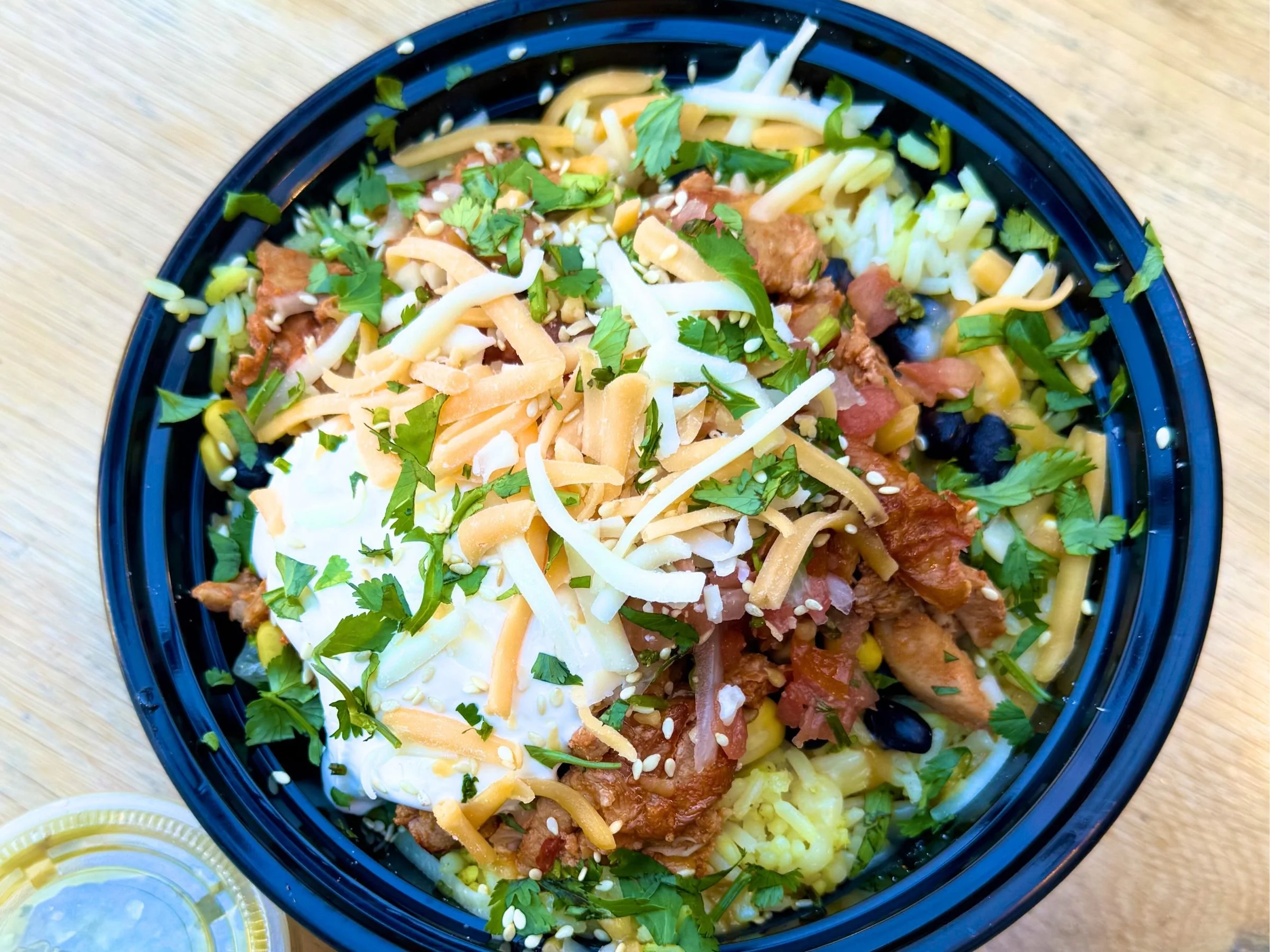 Korean fusion rice bowl with pico beans corn and fresh toppings