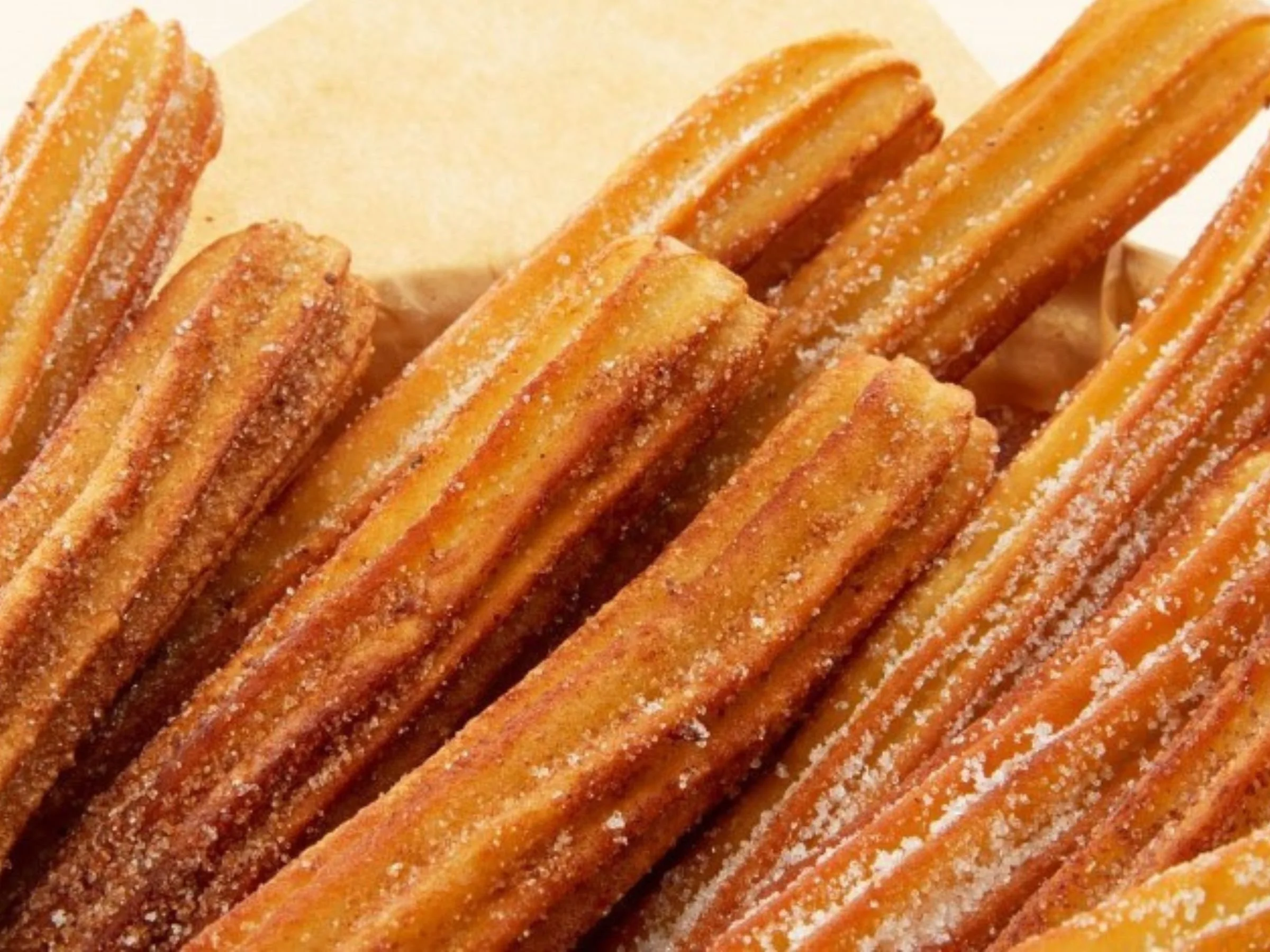 crispy churros dusted in cinnamon sugar