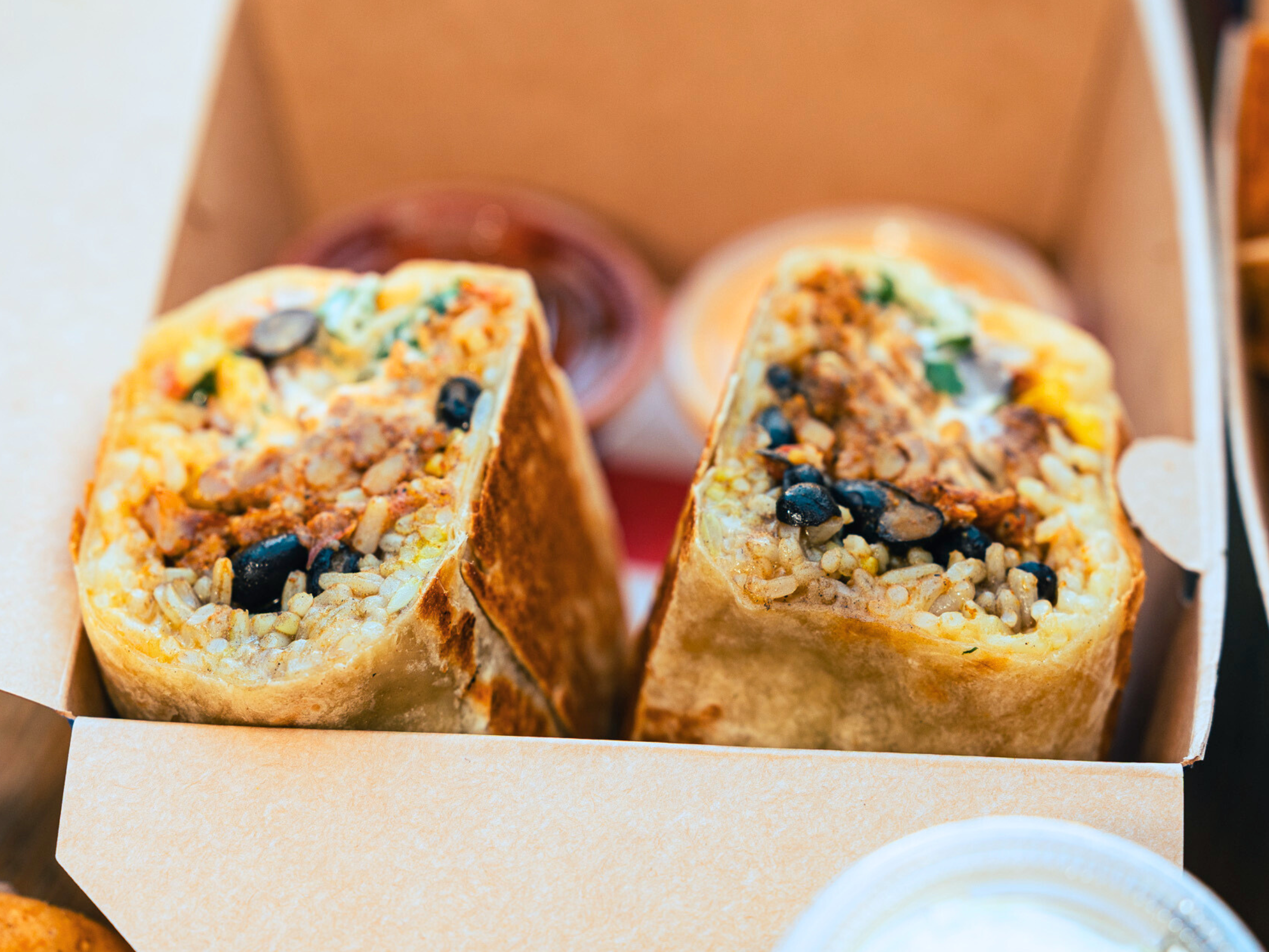 Vegan Korean Mexican burrito with rice beans and vegetables