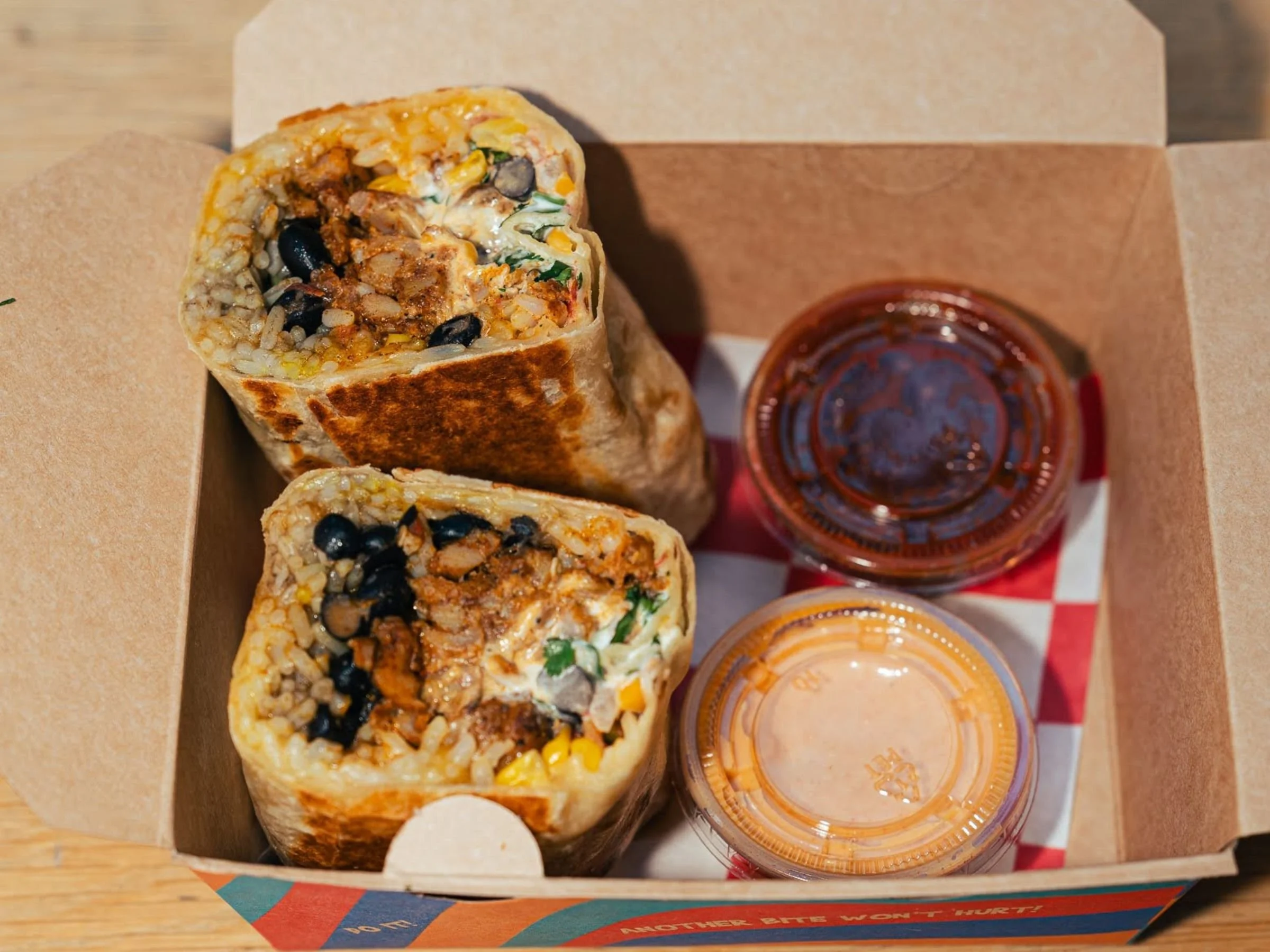 Korean Mexican fusion burrito with bulgogi beef rice beans and pico