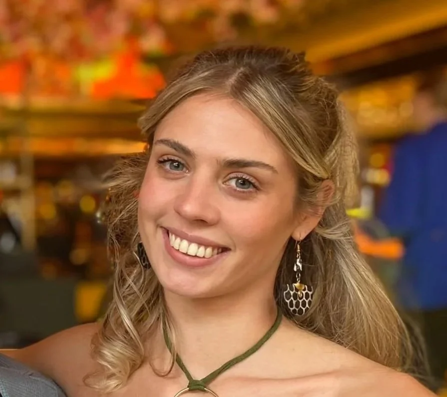 Blonde woman smiling at the camera