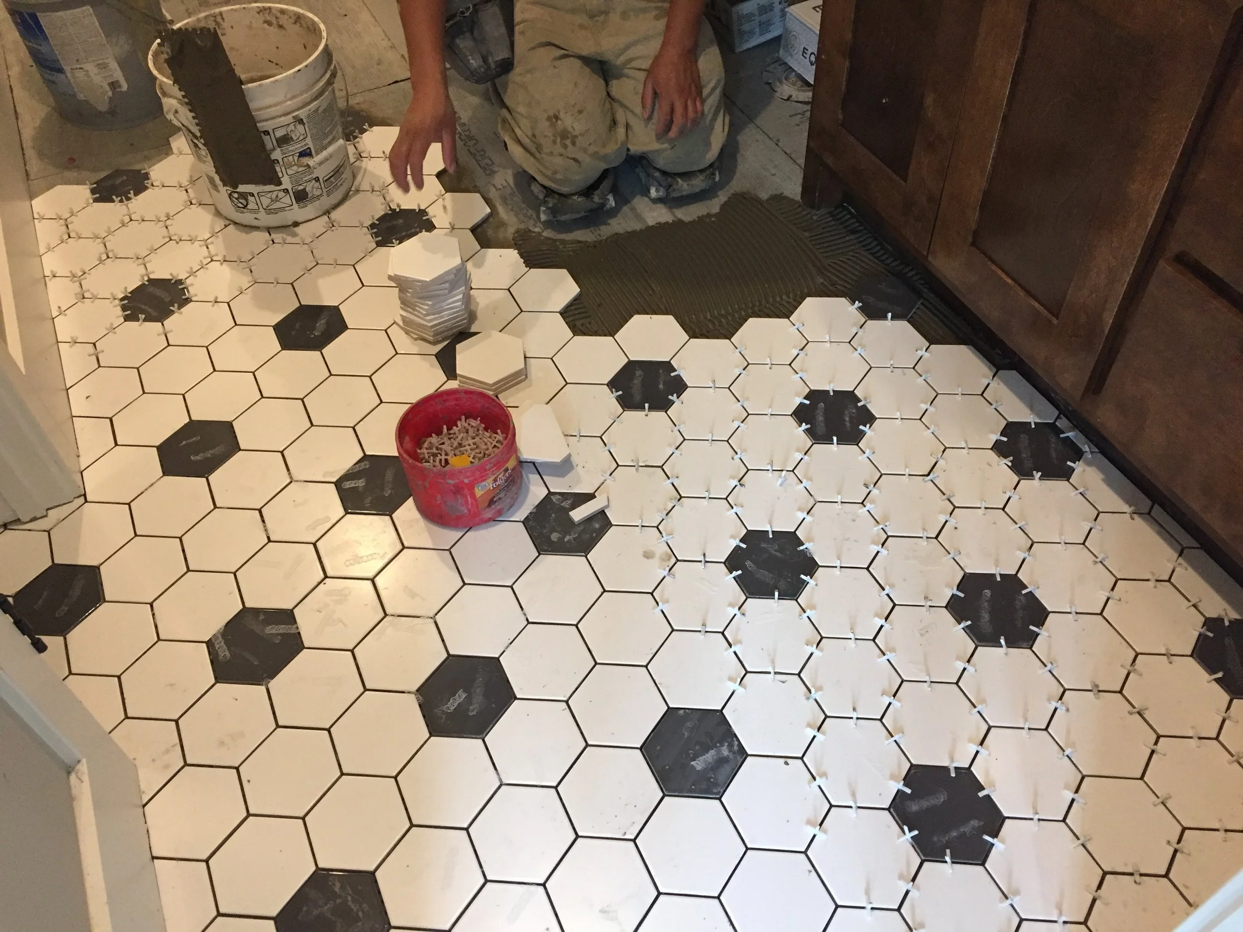 Custom home under construction in Kansas City showing floor tile work by Aspen Homebuilders