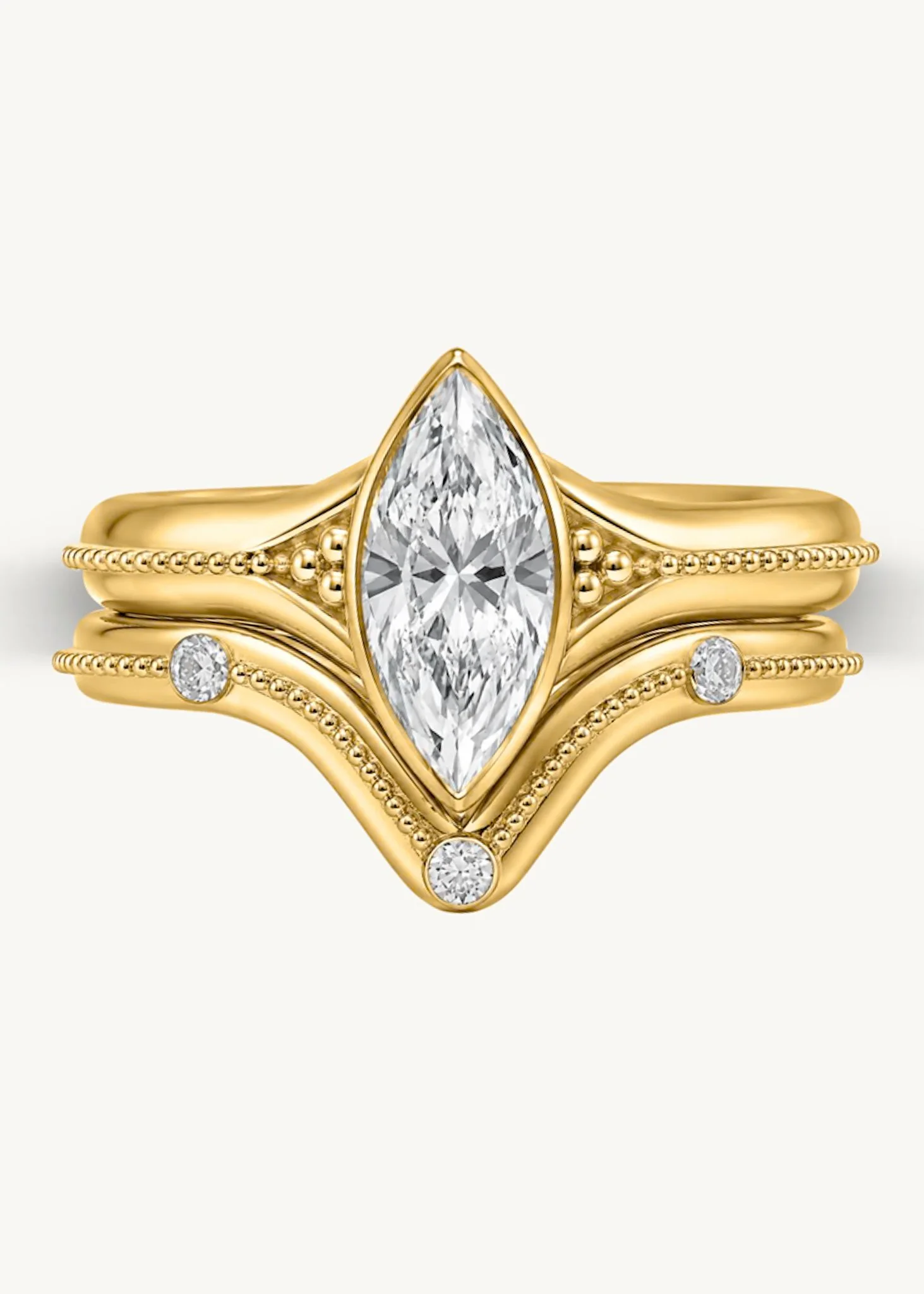Handmade 18k gold Signature Marquise Solitaire and fitted wedding band featuring traditional granulation and textured detailing by Rings by NK.