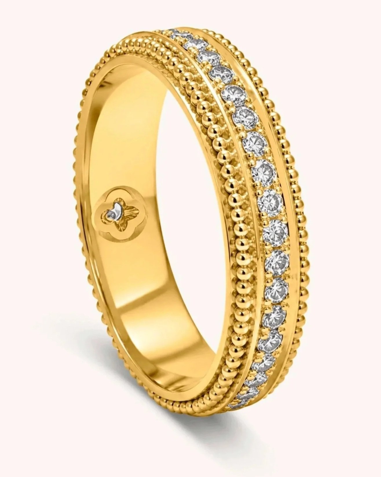 Handmade 18k gold band with fine fused granulation running along the outer edge and decorative stone setting.