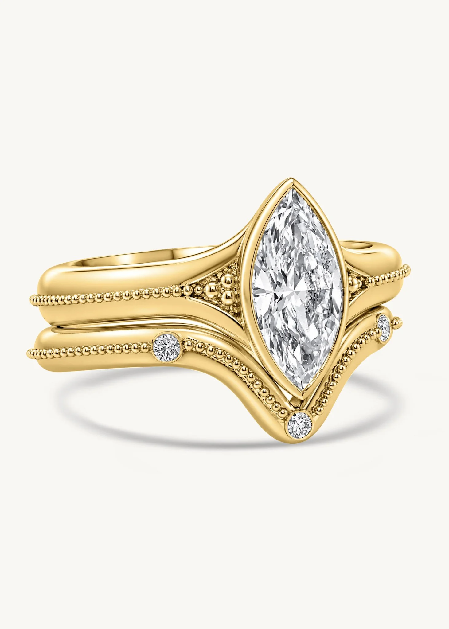 18k gold marquise diamond Signature Solitaire with fitted diamond wedding band and handmade granulation, side view.