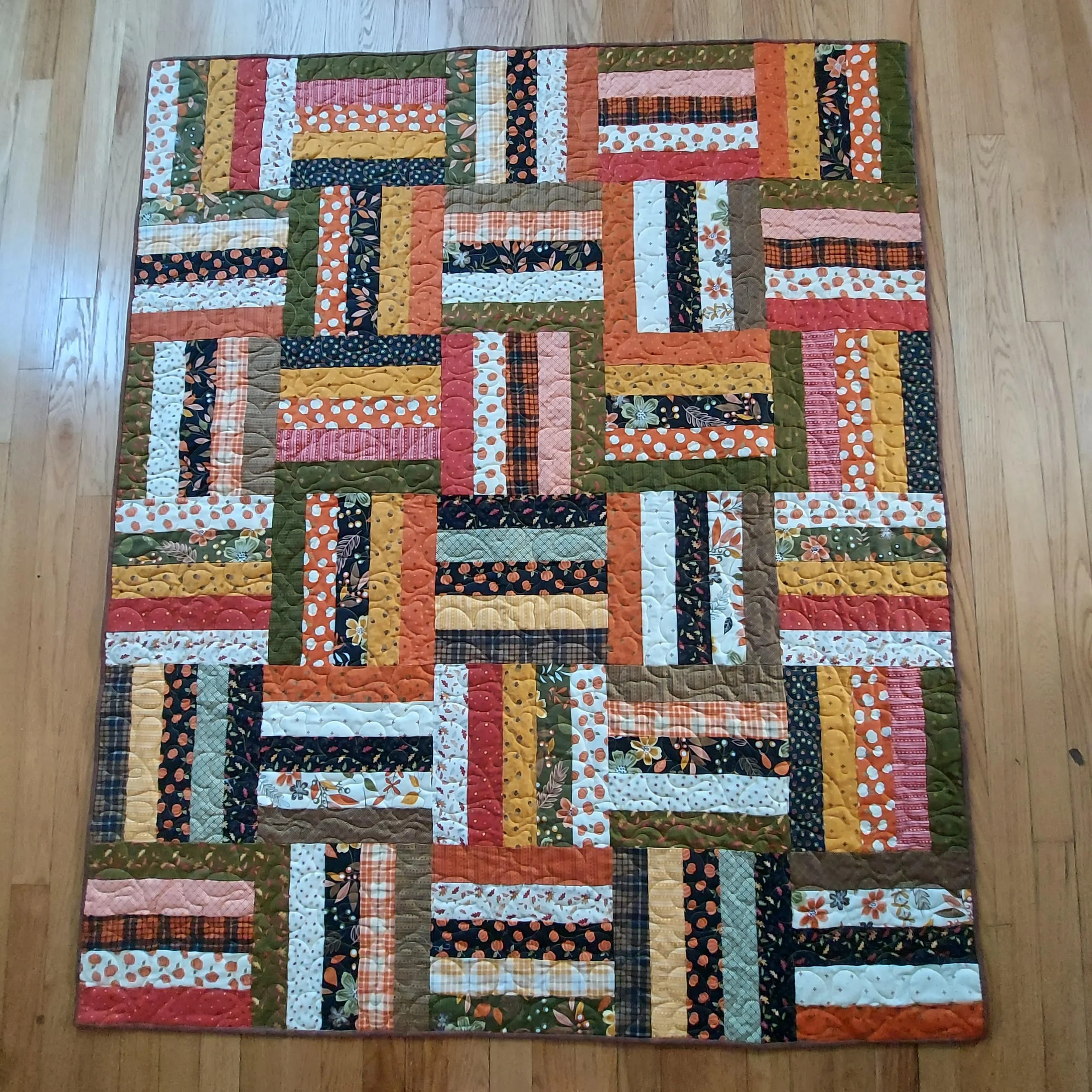 Autumn Rail Fence, April 2026 (quilting by Fran Scher)