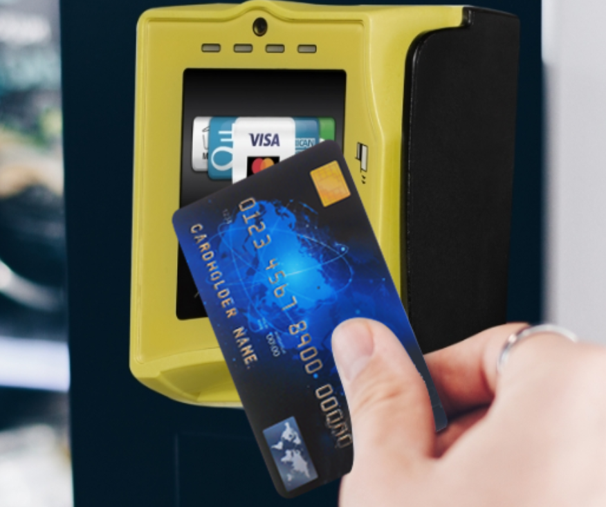 Customer using a Nayax VPOS Touch cashless payment terminal on an H2O Vend vending machine.