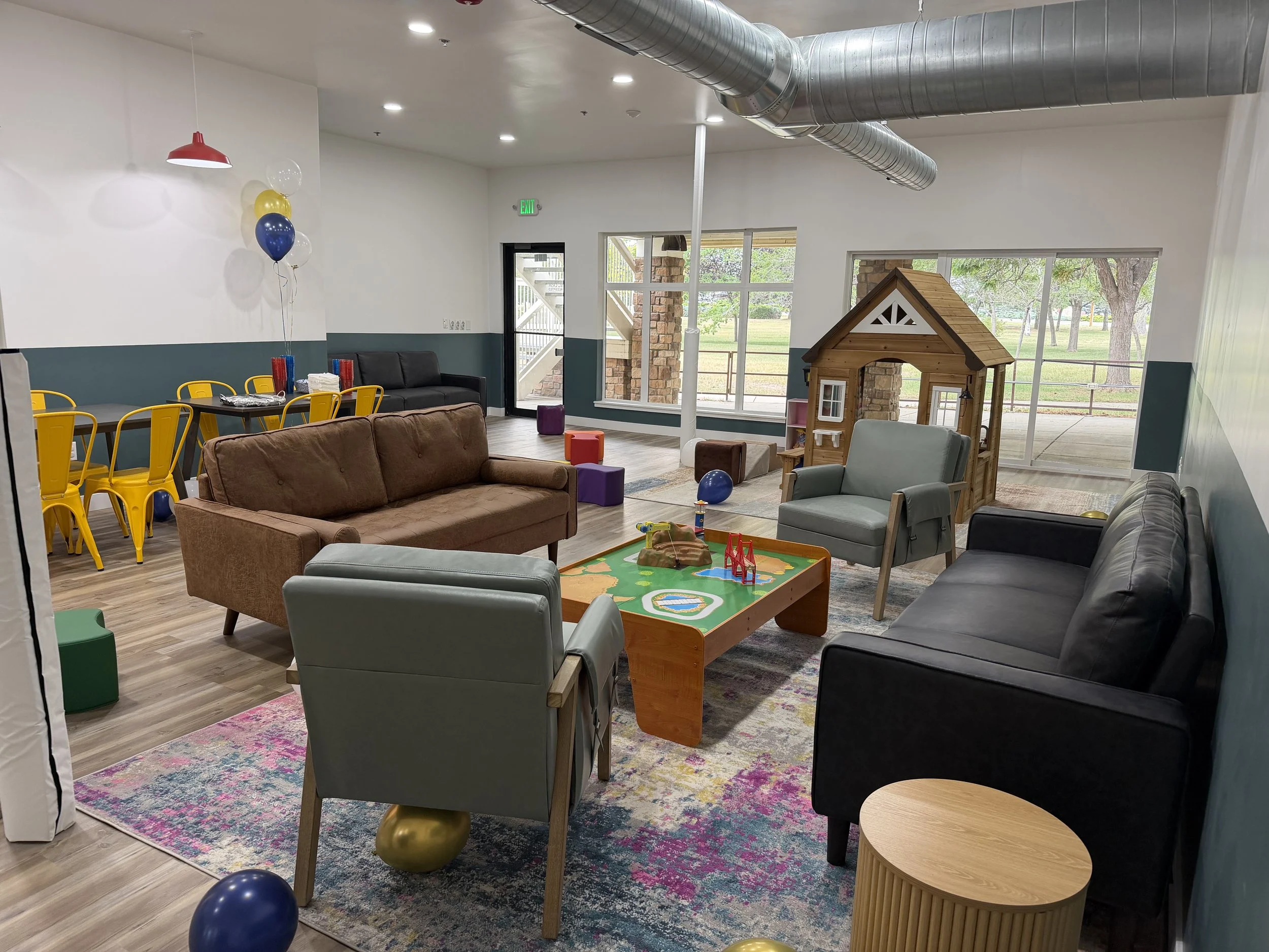 raising parents playspace with playhouse traintable couches and blocks