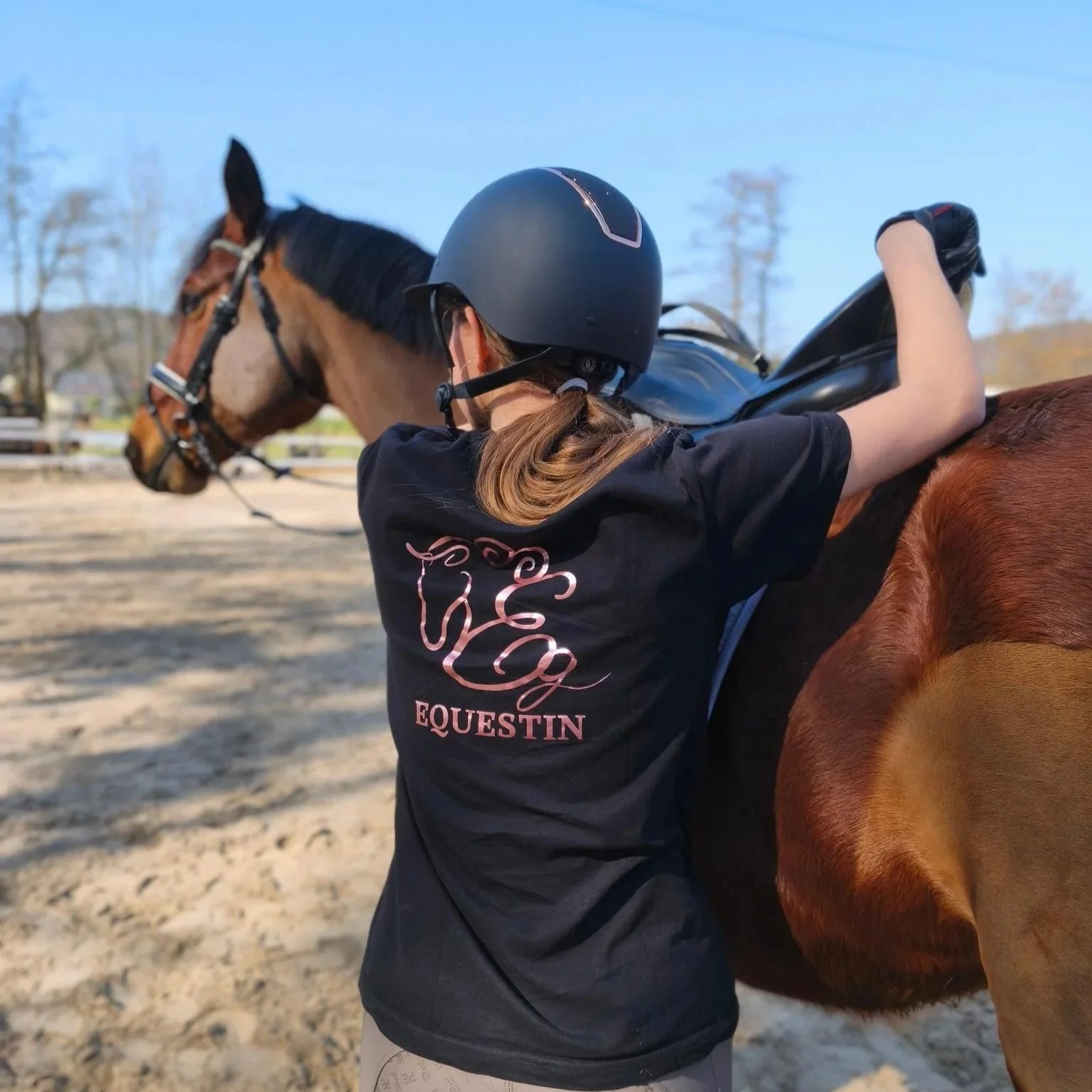 Rider getting on a horse