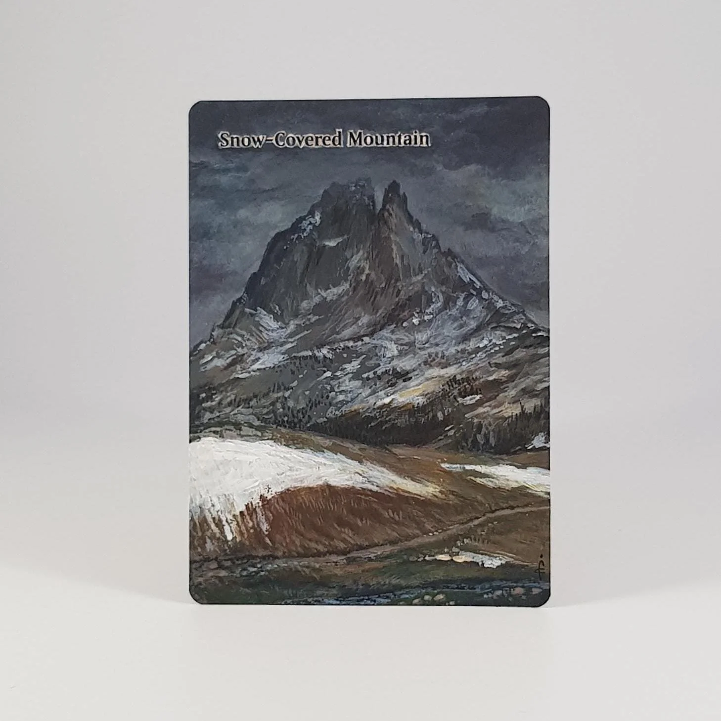 Painting of a snow-covered mountain with dark clouds in the sky.