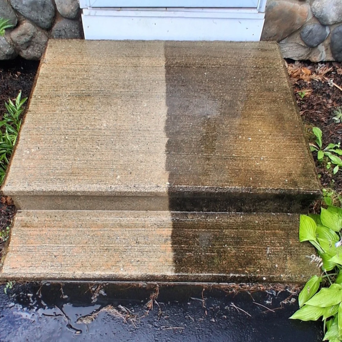 Progress picture of pressure washing concrete stairs
